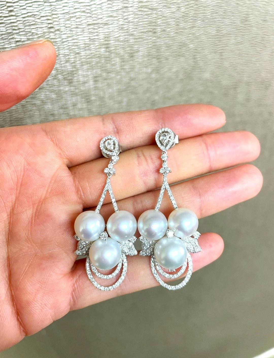 The Following Items we are offering are this Extremely Rare Beautiful 18KT Gold Fine Rare Large South Sea Pearl Fancy Diamond Dangle Drop Earrings. These Magnificent Earrings are comprised of 6 Rare Fine Large AA-AAA South Sea Pearls with Gorgeous