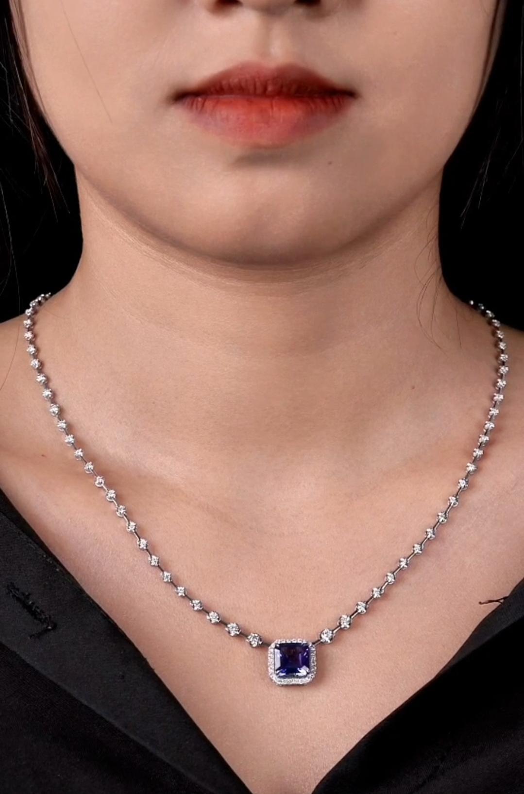 The Following Item we are offering is a Rare Important Spectacular and Brilliant 18KT Gold Large Gorgeous Tanzanite Diamond Necklace. Necklace consists of a Rare Fine Magnificent Fancy Shaped Tanzanite with Diamonds on Chain!! T.C.W. Approx