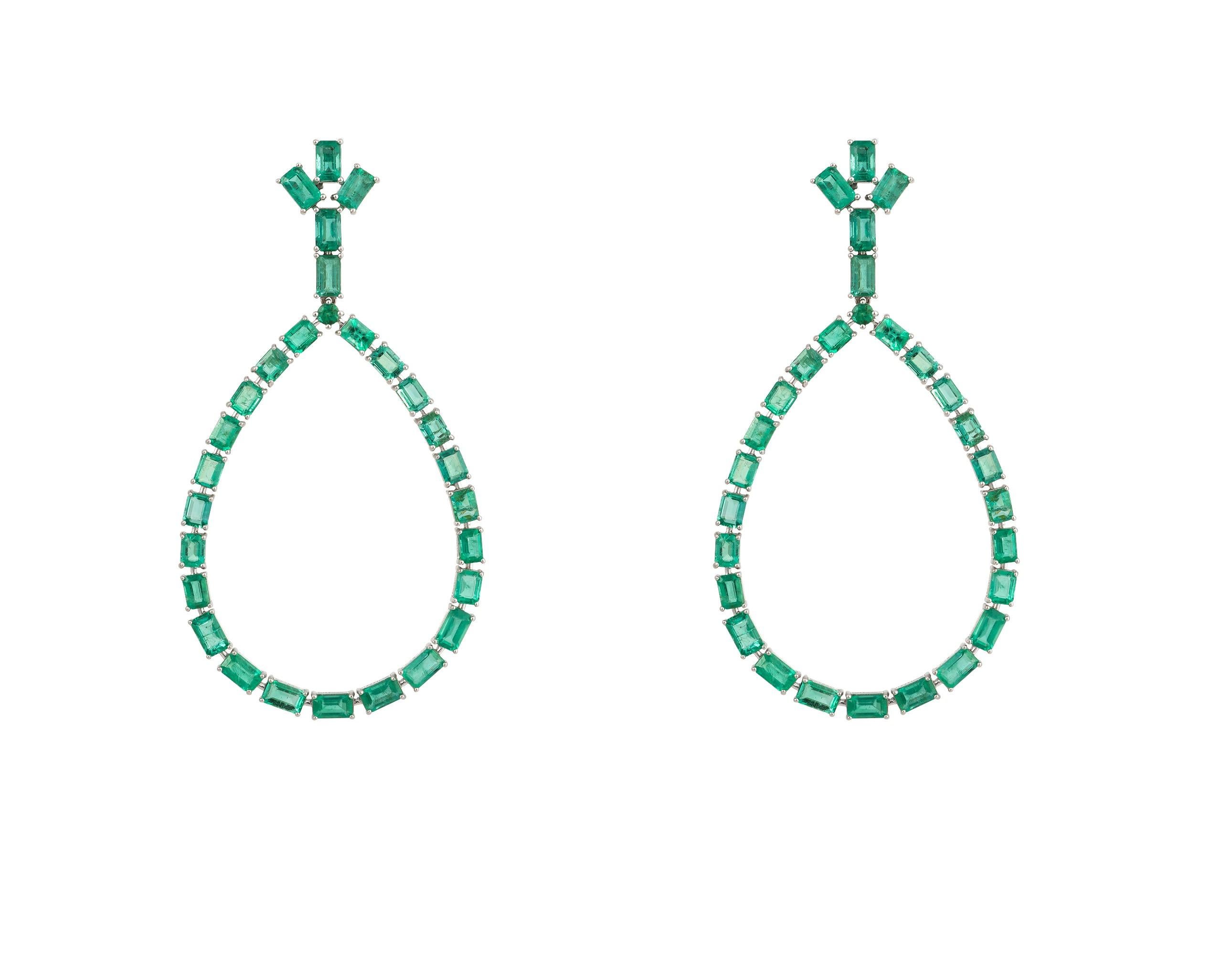 The Following Item we are offering is this Rare Important Radiant 18KT Gold Gorgeous Glittering and Sparkling Magnificent Fancy Baguette Cut Emerald Dangle Earrings. Earrings Contains approx 13CTS of Beautiful Fancy Baguette Cut Shimmering
