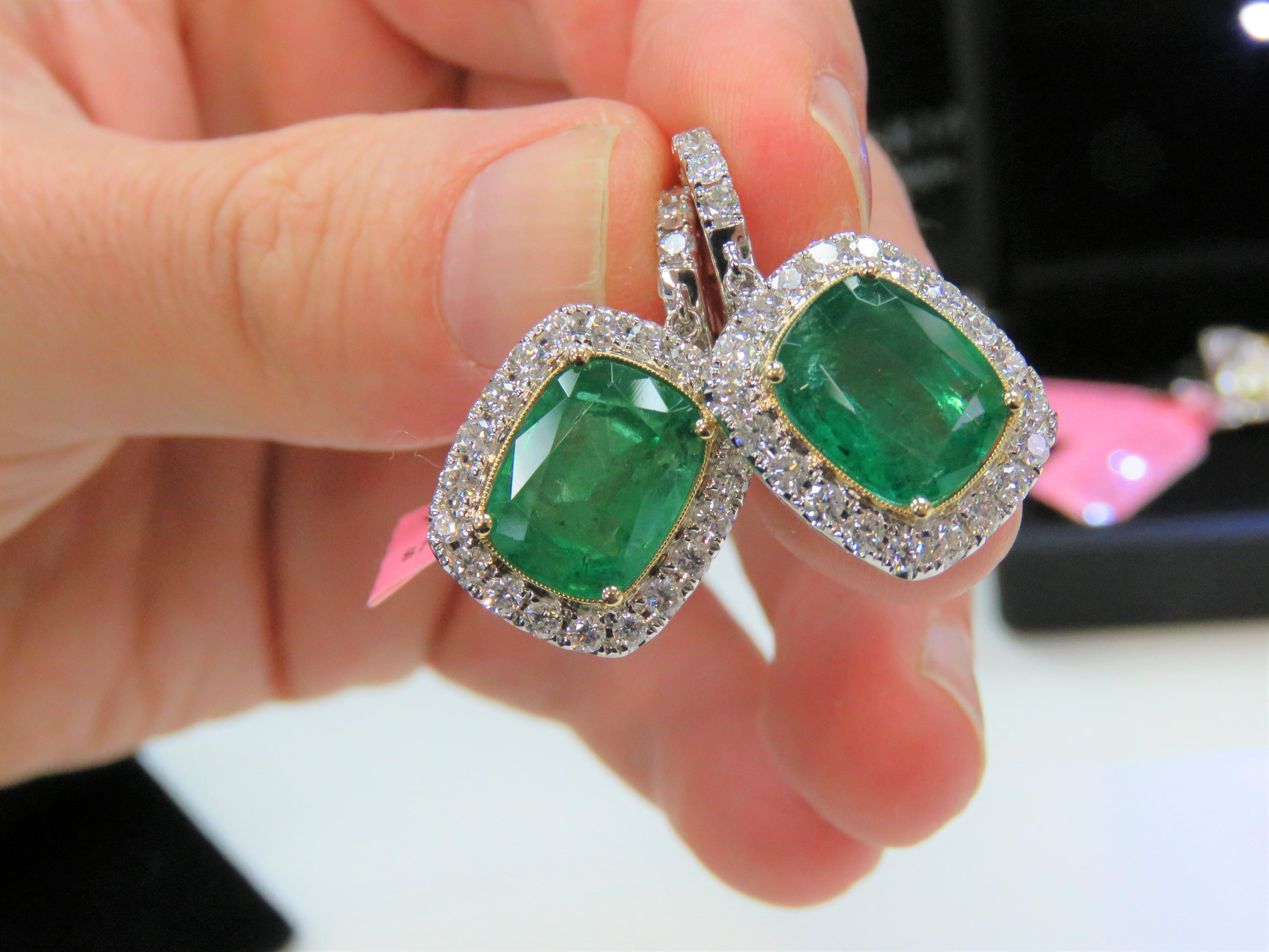 The Following Items we are offering is a Pair of Rare 18KT Gold Large Emerald Diamond Dangle Earrings. Earrings are comprised of Finely Set Gorgeous Large Gorgeous Green Emerald Diamond Earrings surrounded with Large Full Cut Round Diamonds!!!
