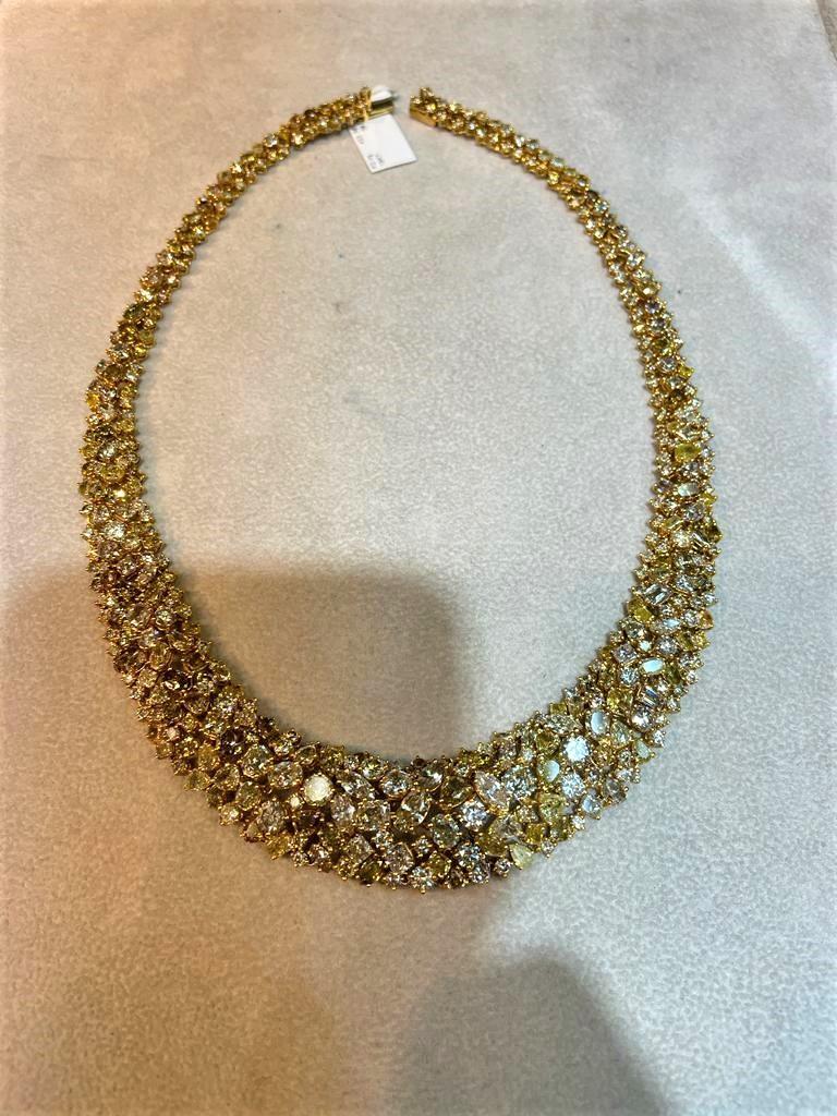The Following Item we are offering is this Rare Important Radiant 18KT Gold Gorgeous Glittering and Sparkling Magnificent Rare Yellow Diamond Necklace. Necklace contains approx 55CTS of Beautiful Fancy Yellow, Cognac, Champagne and Orange