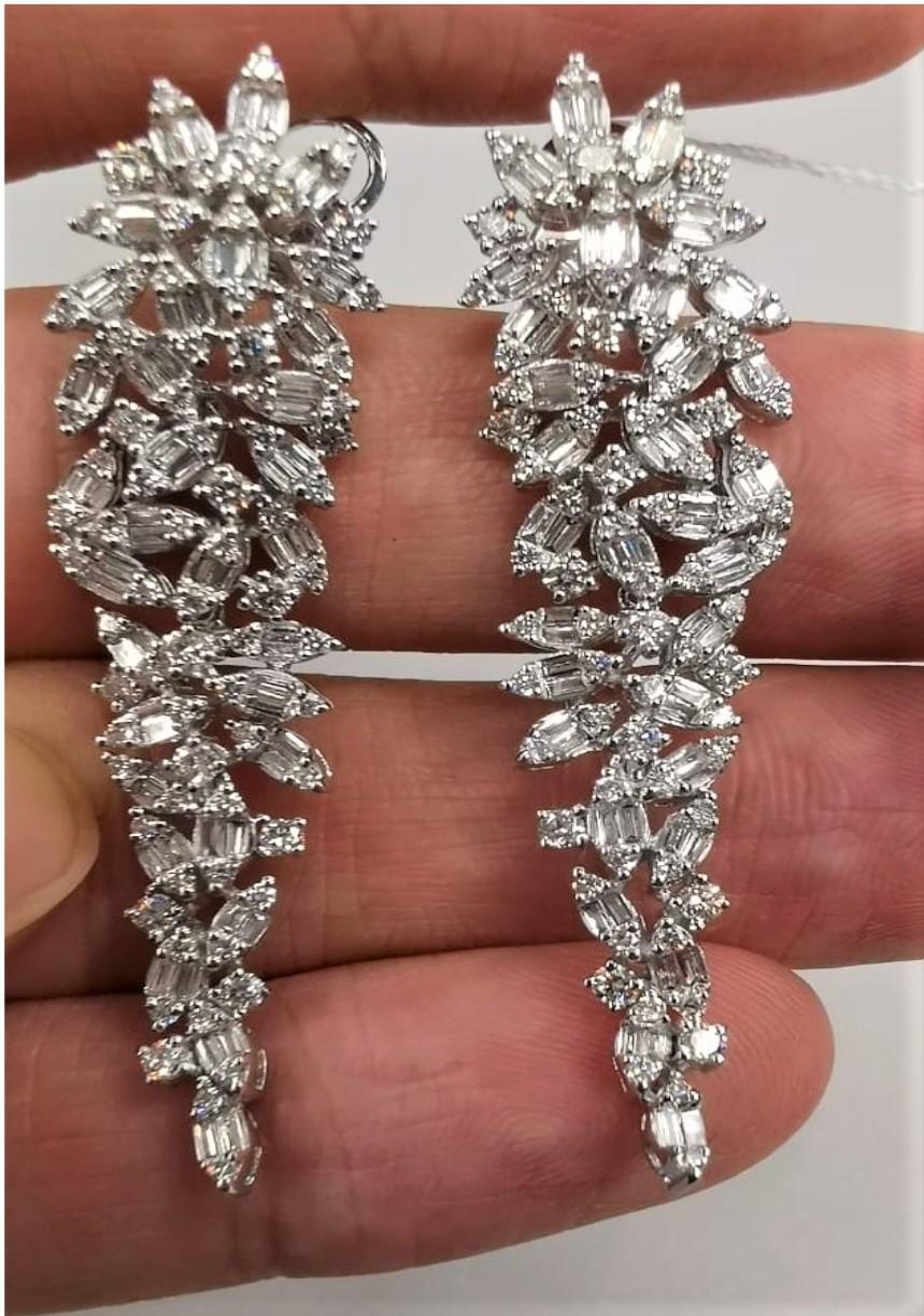 The Following Items we are offering is a Rare Important Spectacular and Brilliant 18KT Gold Large Gorgeous Fancy Cascading Diamond Drop Draping Earrings. Earrings consists of Rare Fine Magnificent Fancy Glittering Diamonds. T.C.W. over 2.50CTS of