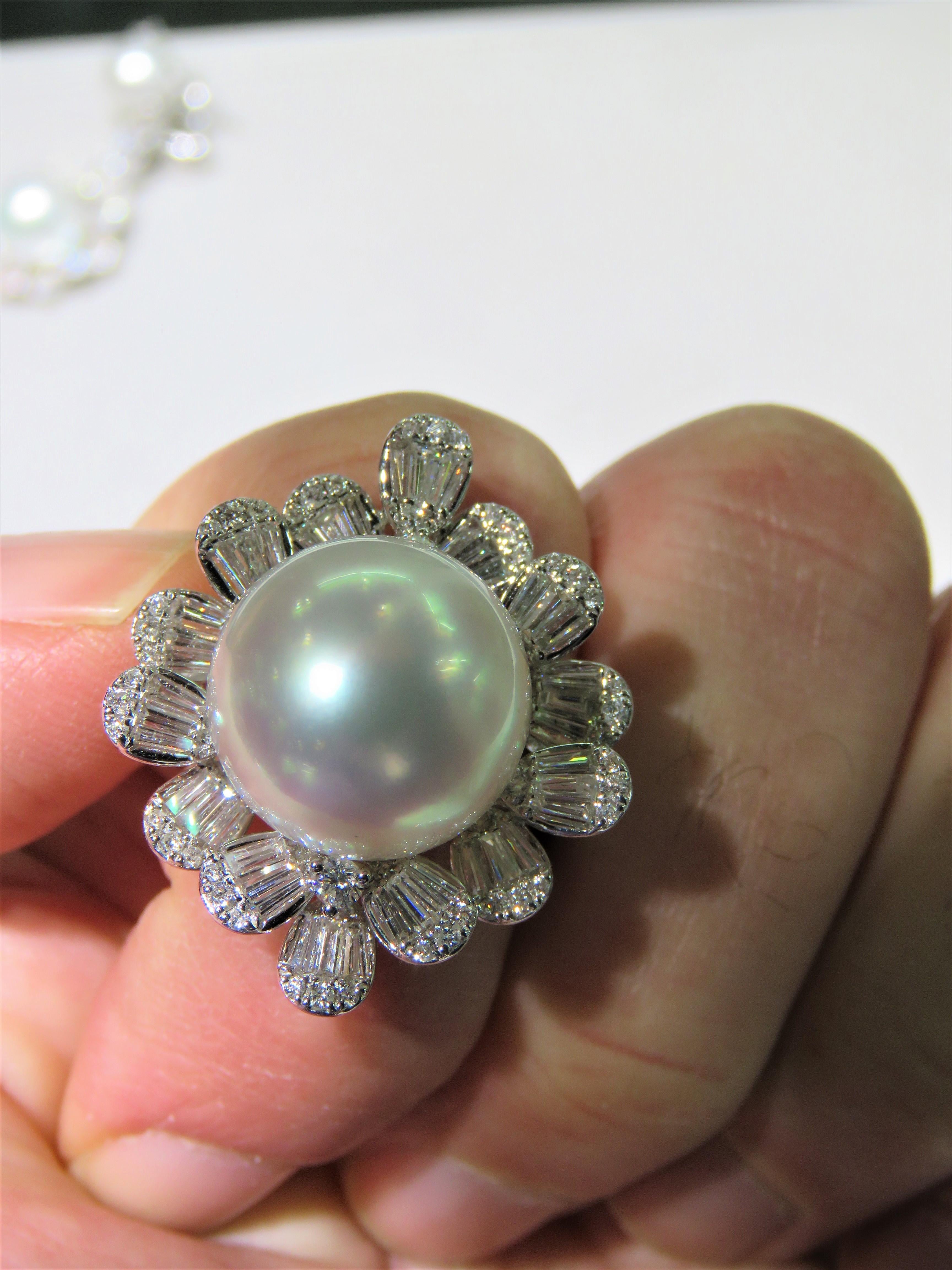 The Following Item we are offering is this Extremely Rare Beautiful 18KT Gold Fine Rare Large South Sea Pearl Fancy Flower Diamond Floral Ring. This Magnificent Ring is comprised of a Rare Fine Large South Sea Pearl with Gorgeous Glittering