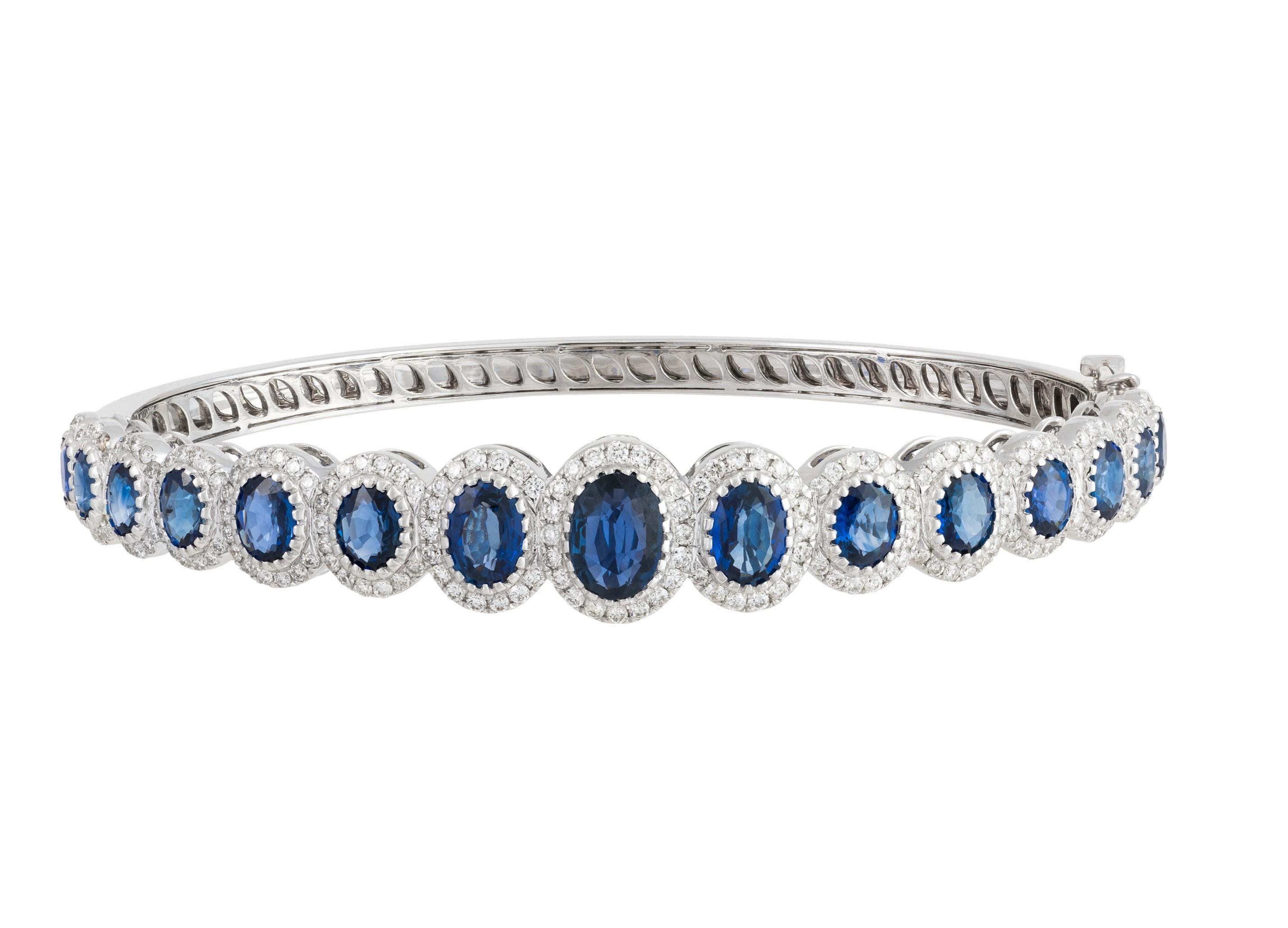 The Following Item we are offering is this Beautiful Rare Important 18KT Gold Sparkling Fancy Sapphire Diamond Cuff Bangle Bracelet. Bangle FEATURES Magnificent Rare Gorgeous Fancy Large Sapphires surrounded with Diamonds. T.C.W approx 7CTS!! 
This