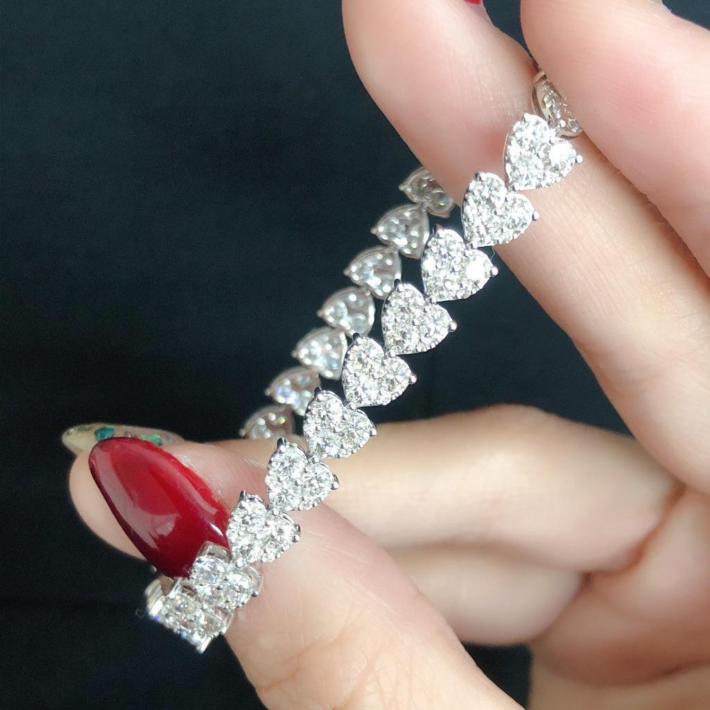 The Following Item we are offering is this Beautiful Rare Important 18KT White Gold Large Glittering Heart Diamond Tennis Bracelet. Bracelet is comprised of over 7.50CTS Magnificent Rare Gorgeous Fancy Glittering Diamonds!!! The Diamonds are of