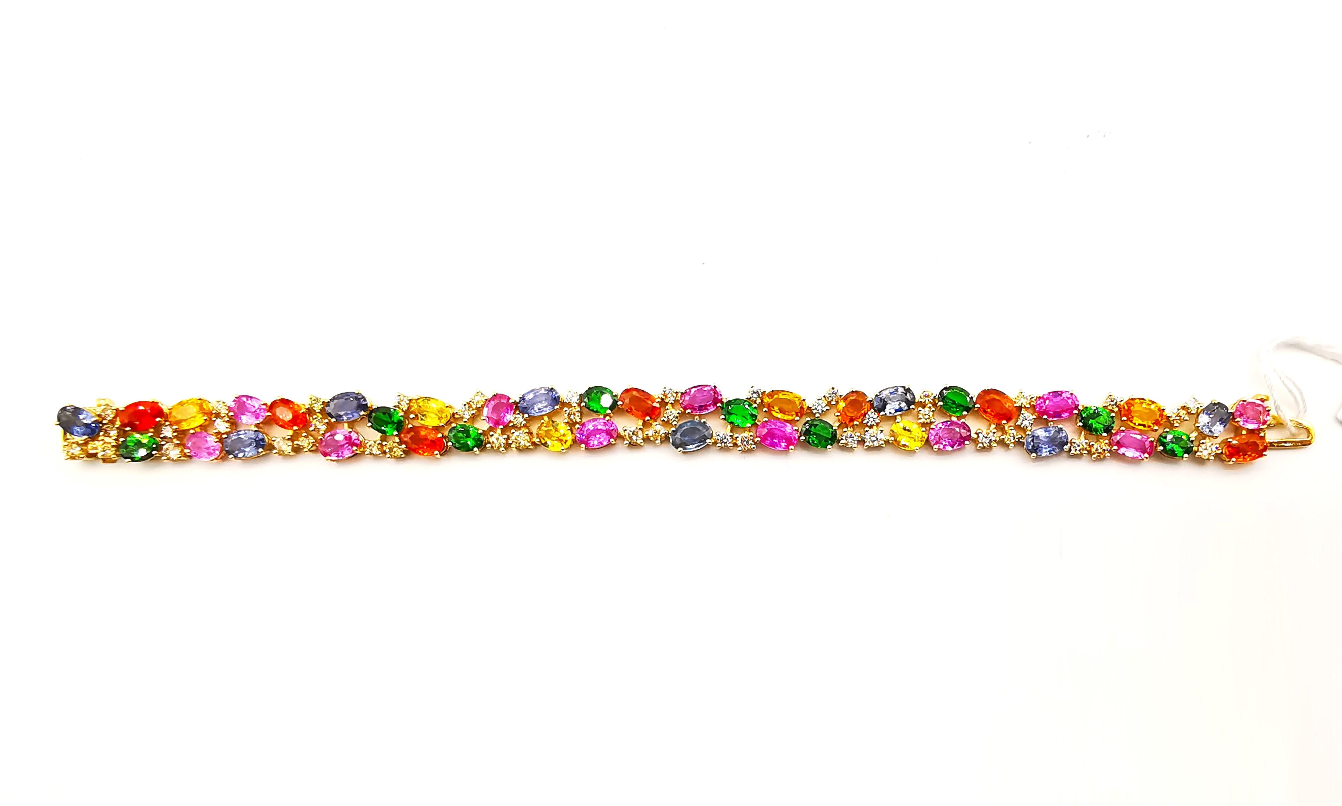 The Following Item we are offering is a Rare Important Radiant 18KT Gold Rare Gorgeous Fancy Multi Rainbow Sapphire and Diamond Bracelet. Bracelet is comprised of a Gorgeous Array of Fancy Colored Sapphires including Pinks, Oranges, and Yellows,