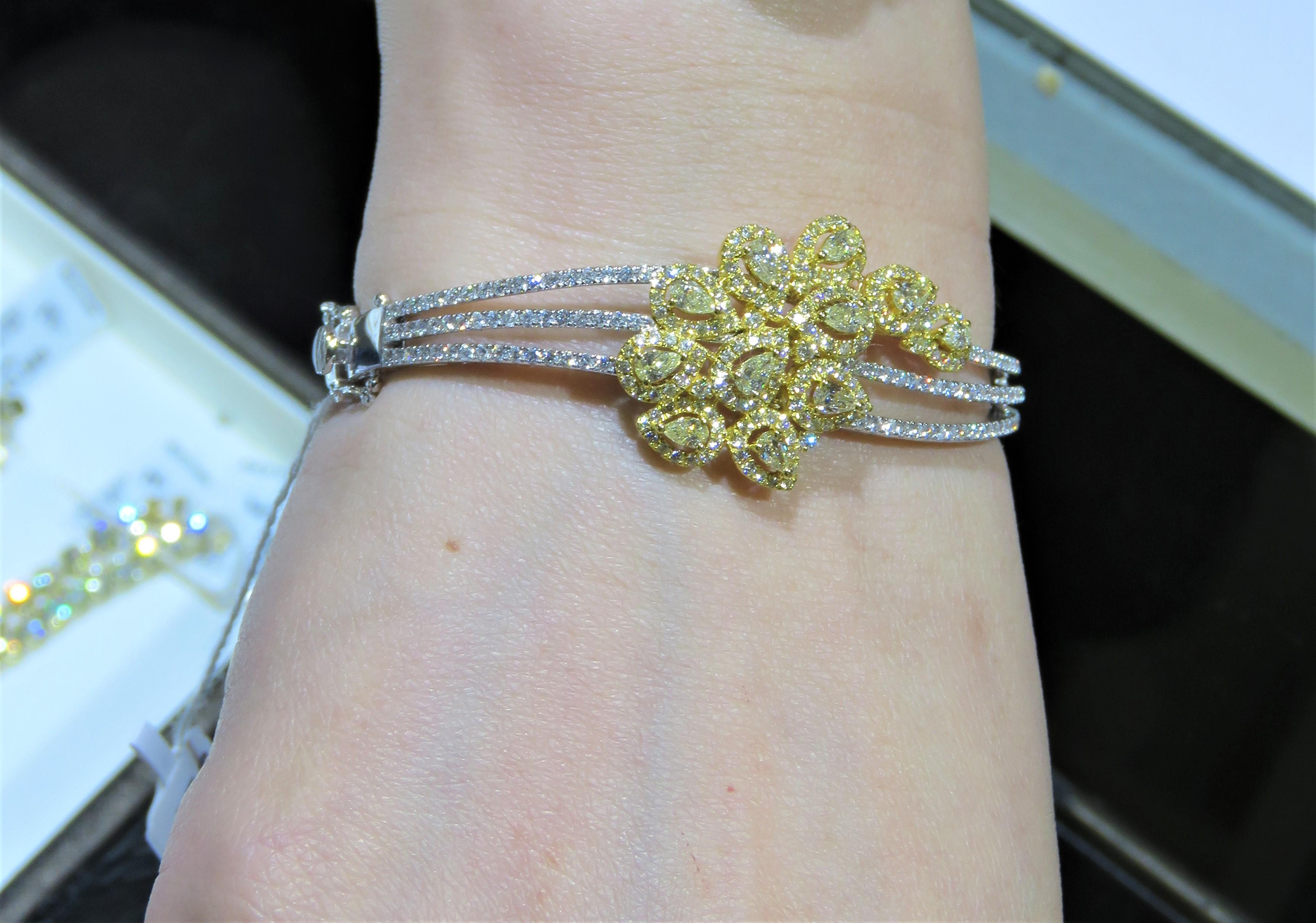 NWT $19, 579 18KT Gold Rare Fancy Yellow Diamond Triple Row Bangle Bracelet In New Condition For Sale In New York, NY
