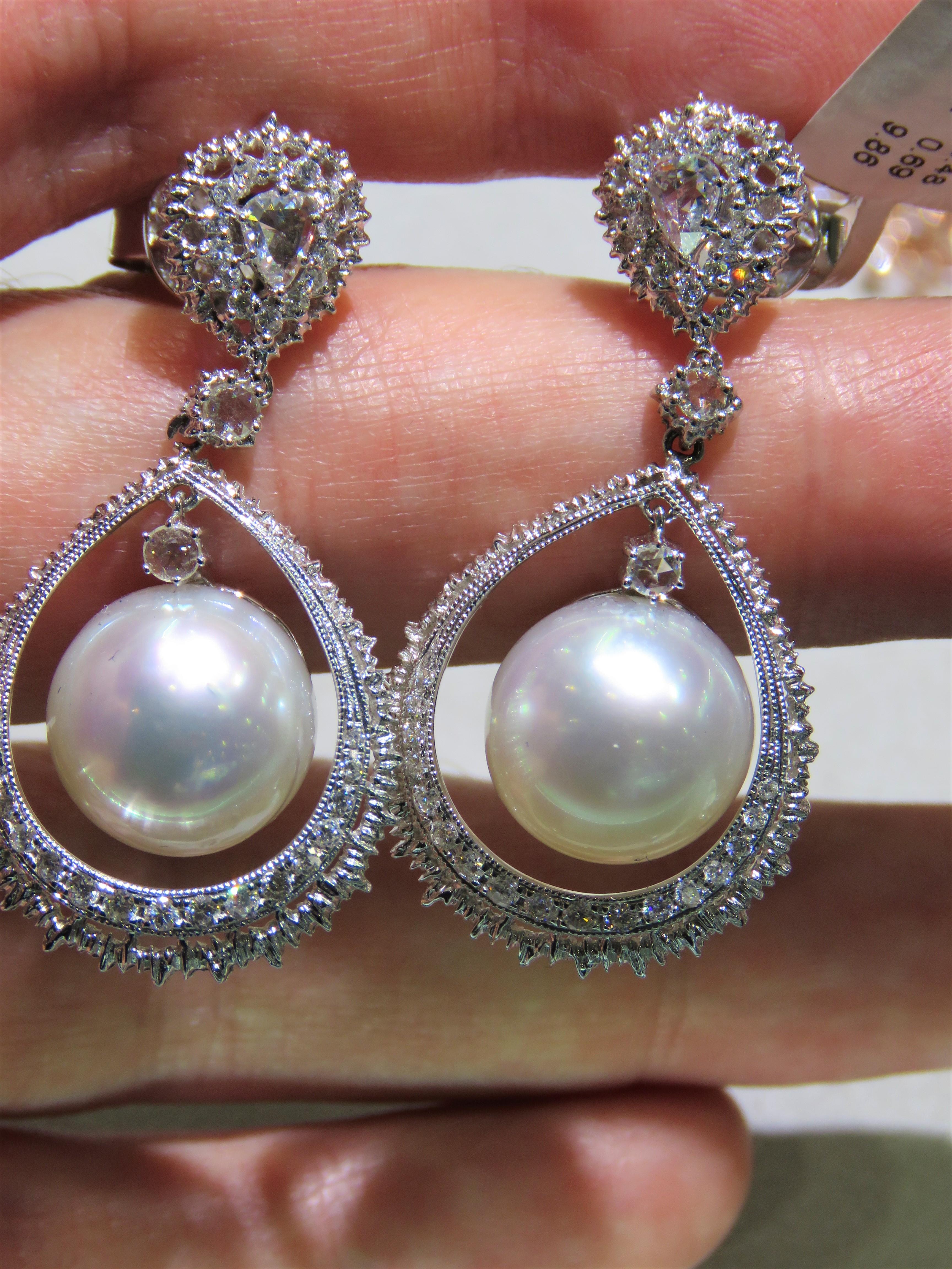 The Following Item we are offering are these Extremely Rare Beautiful 18KT Gold Fine Large Fancy South Sea White Pearl and Diamond Earrings. Each Earring features Gorgeous Glittering Diamonds adorned by a Magnificent Fine Fancy Large South Sea