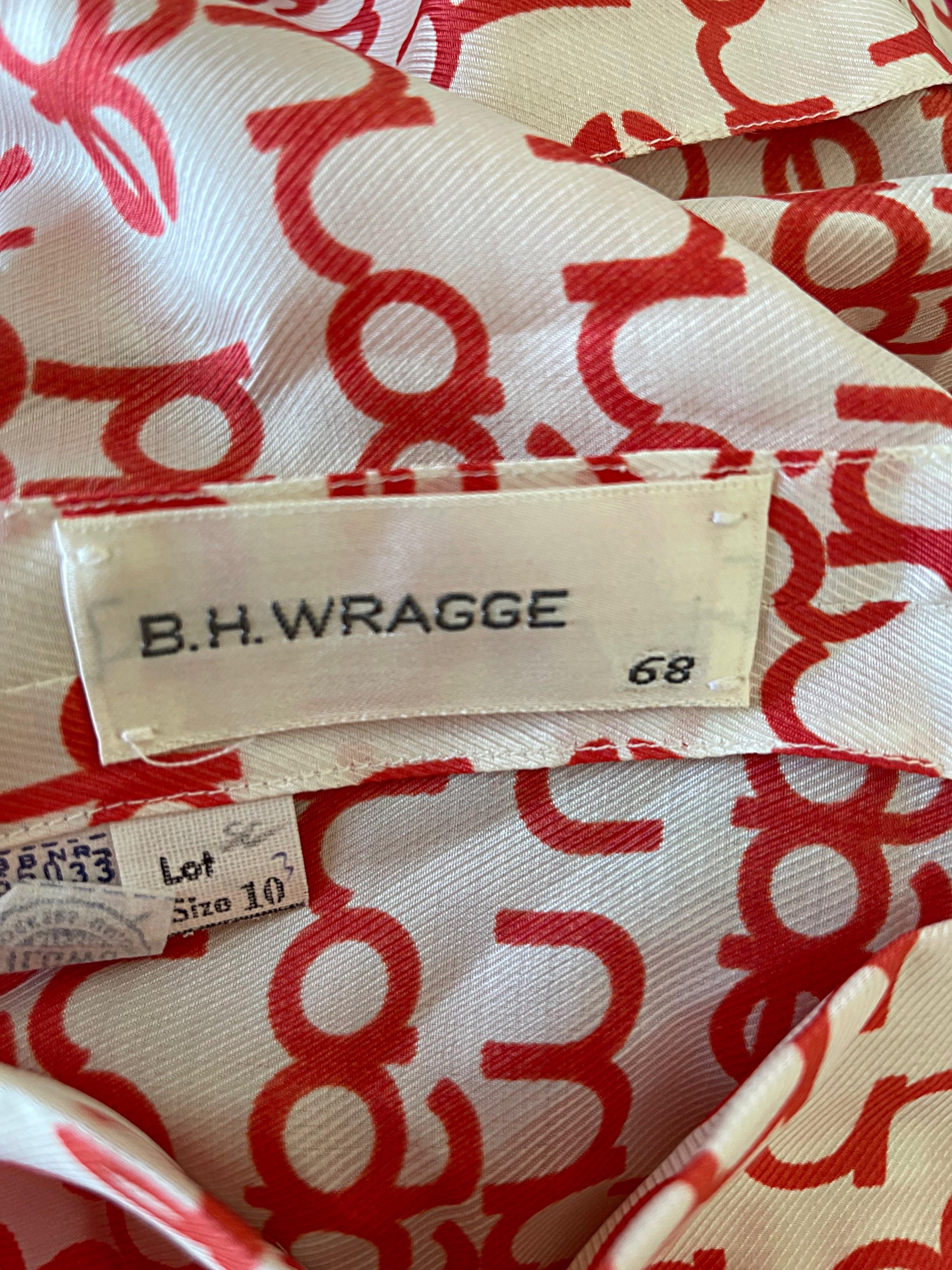 Chic deadstock ( new with original store tags attached ) BH WRAGGE red and white logo print silk long sleeve blouse top ! Features the brand’s signature logo throughout. Hidden button up the front. 
In perfect unworn condition
Made in