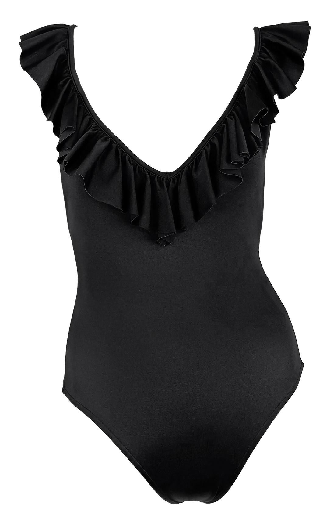 This new-with-tags black one-piece swimsuit by Bill Blass from the 1980s features a plunging neckline trimmed with ruffles that extend over the shoulders and around the deep-cut back. Crafted from stretch swim fabric, the design offers a flattering