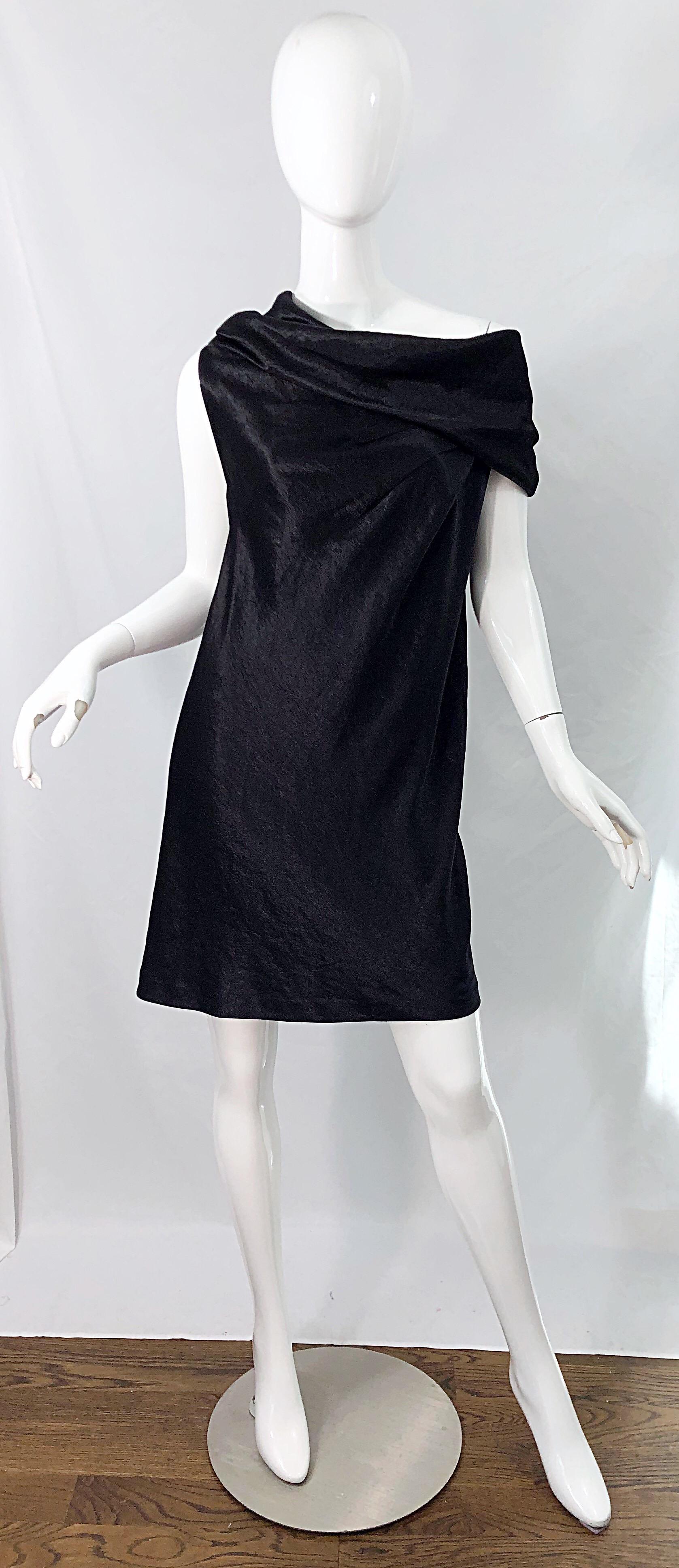 Chic brand new with original store tags late 90s DONNA KARAN black metallic rayon off-shoulder dress ! Features a soft luxurious textured metallic rayon - the tag describes it as a metallic satin textured rayon. This beauty simply slips over the