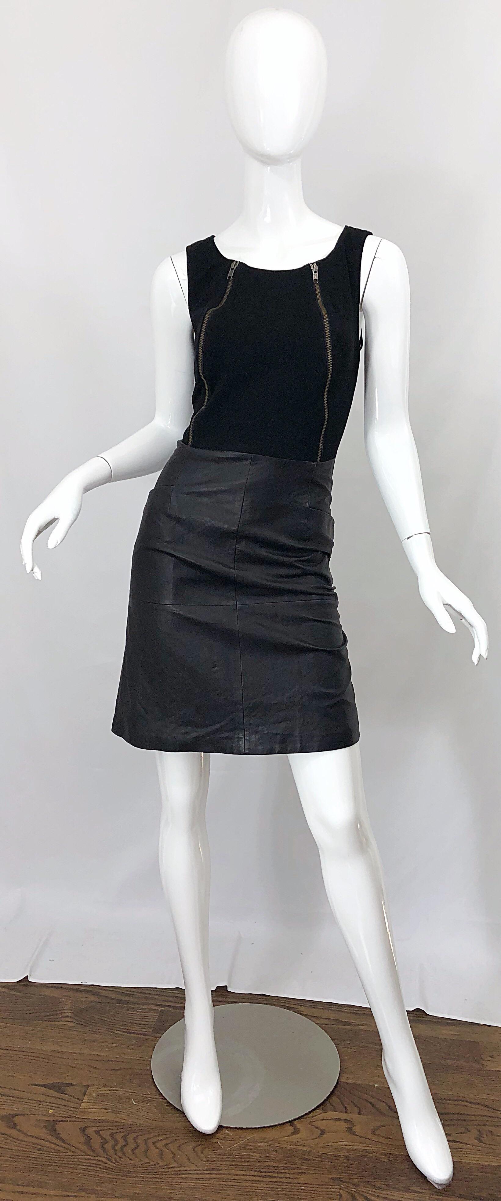 New with tags 1990s JEAN LOUIS SCHERRER black rayon and leather bodycon zipper dress! Features a fitted rayon bodice with zippers at either side of the bust. Flattering black leather skirt features pockets at each side of the waist. Hidden zipper up