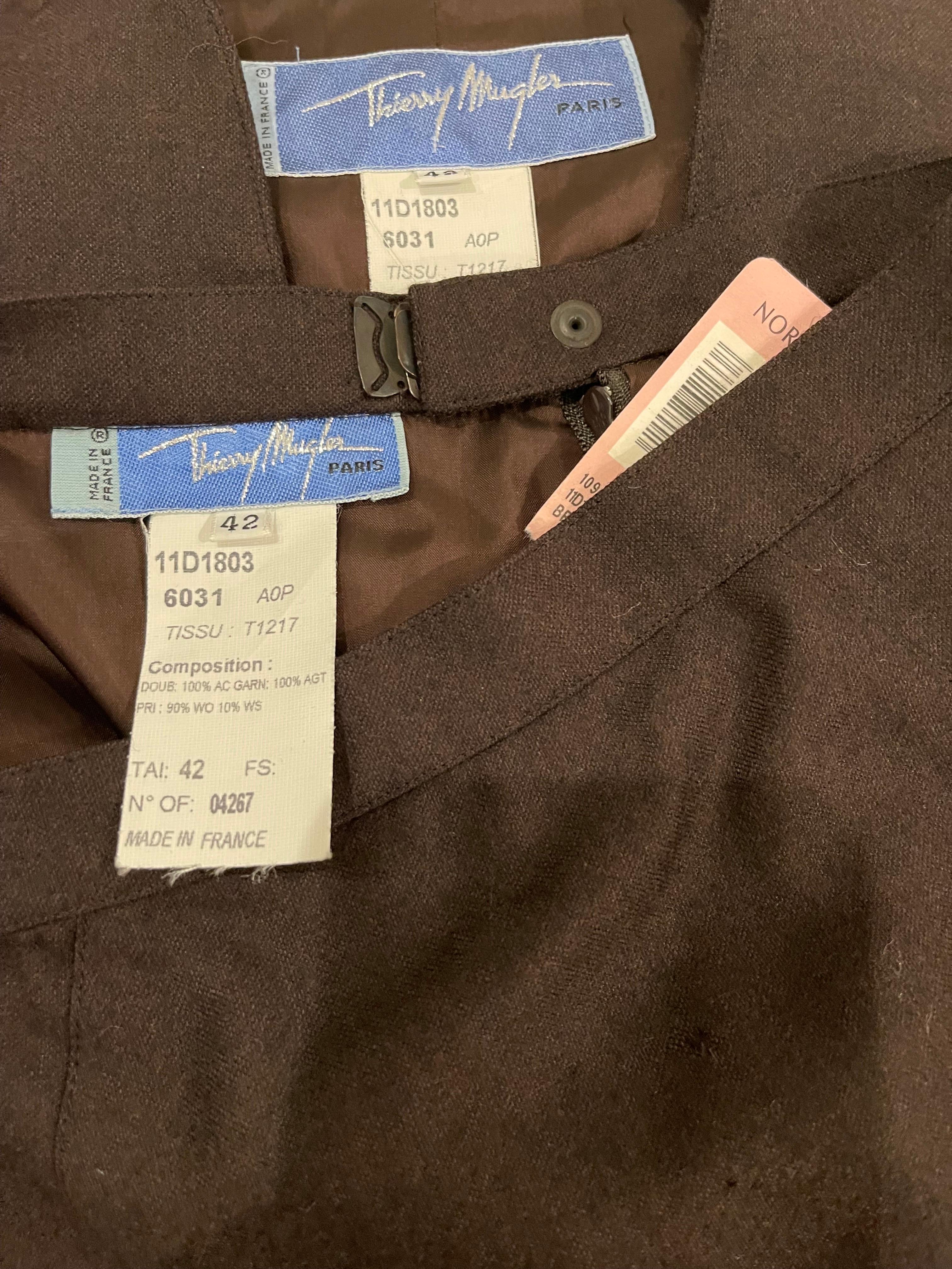 New with tags early 90s THIERRY MUGLER brown wool and cashmere skirt suit ! The perfect brown color that is a great alternative to black. Tailored jacket snaps up the front, with pockets at each side of the waist.  High waisted pencil skirt has