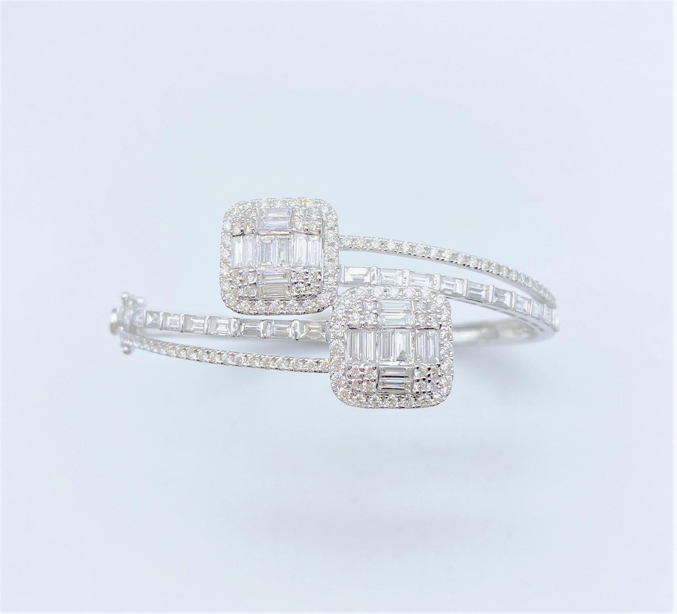 The Following Item we are offering is this Beautiful Rare Important 18KT White Gold Glittering Diamond Bangle Bracelet. Bracelet is comprised of Approx 4CTS of Magnificent Rare Gorgeous Fancy Trillion Baguette Cut Diamonds with Round Glittering