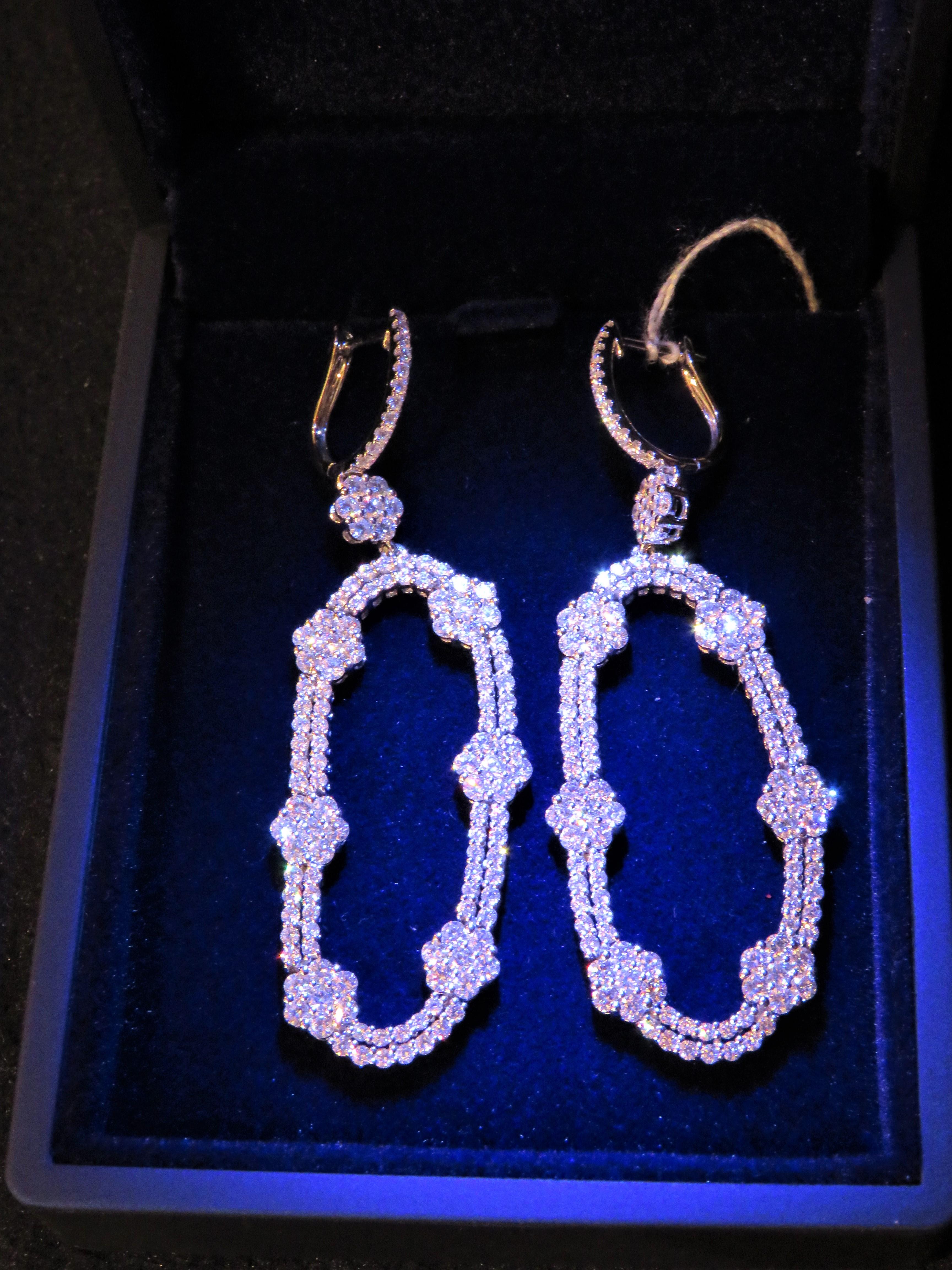 The Following Items we are offering is a Rare Important Radiant 18KT Yellow Gold and 18KT Gold Gorgeous Glittering Baguette Diamond Dangle Earrings. Earrings Feature Gorgeous Rare Fancy Baguette Cut Diamonds Framed with Spectacular Glittering Round