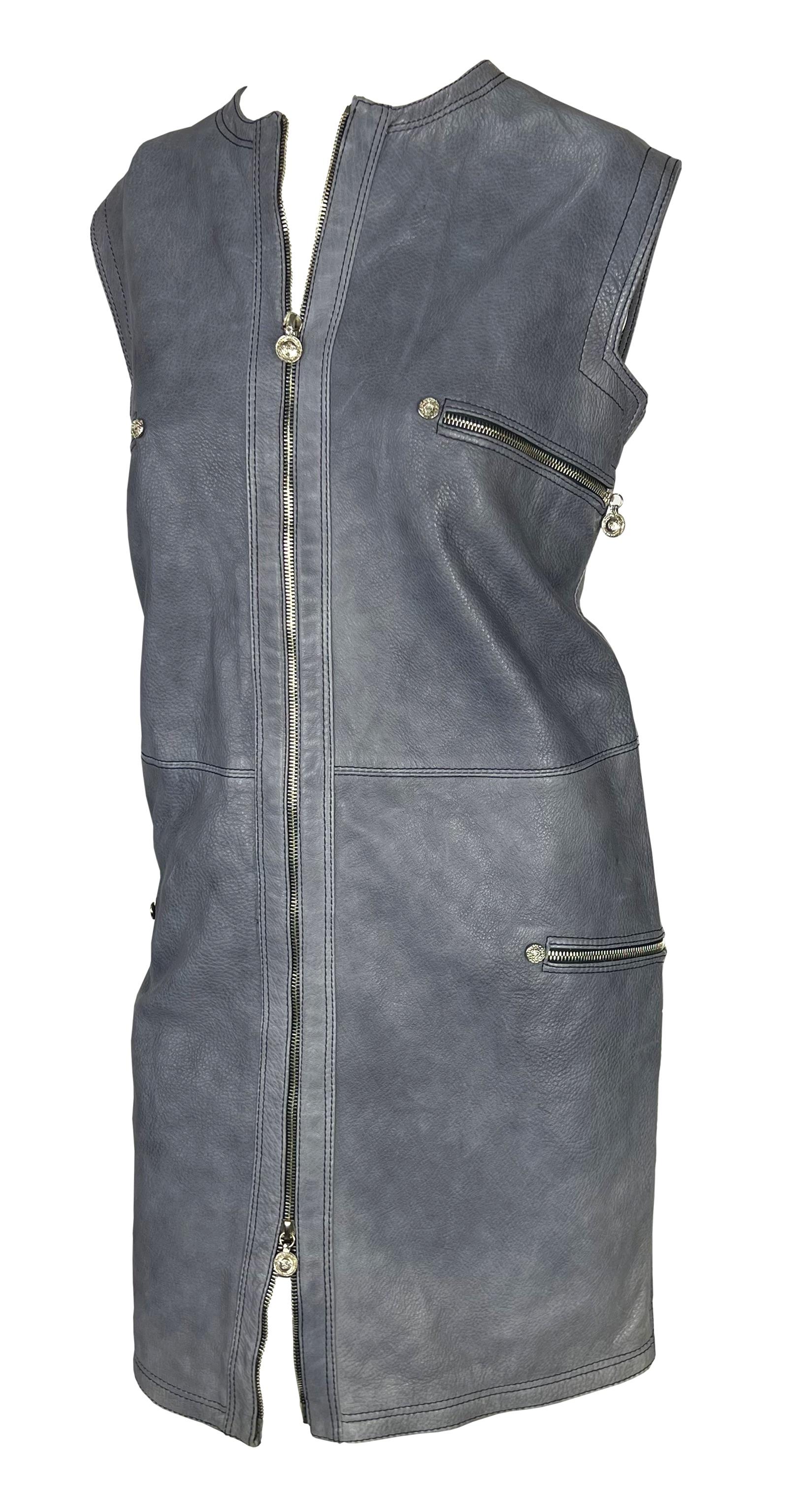 Presenting a beautiful grey leather Gianni Versace shift dress, designed by Gianni Versace. From 1996, this fabulous dress is constructed entirely of leather. The sleeveless dress features a crew neckline, zippers at the bust and hips, and a zipper