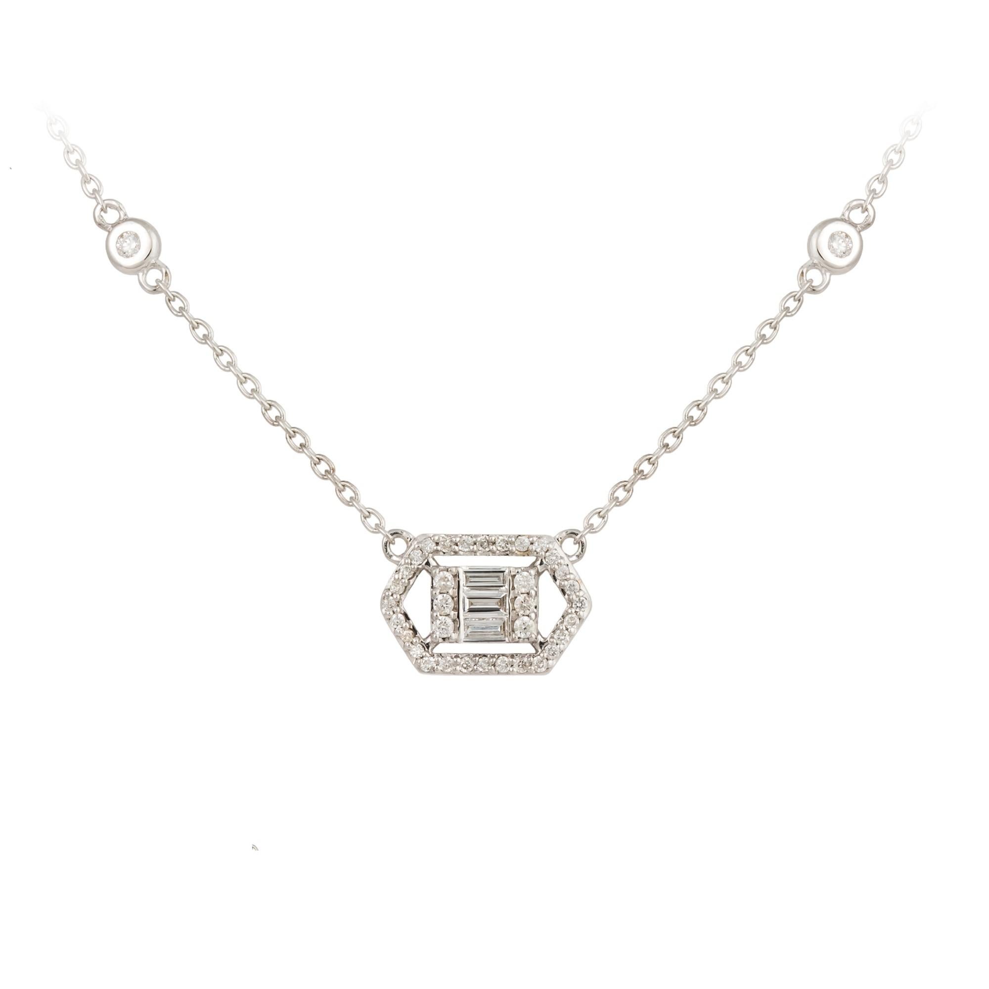 The Following Item we are offering is this Beautiful Rare Important 18KT Gold White Gold Diamond Solitaire Pendant Necklace. Necklace is comprised of .30 Carats of Fine Glittering Fancy Cut Trillion Baguette and Rounds Diamonds. This Beautiful