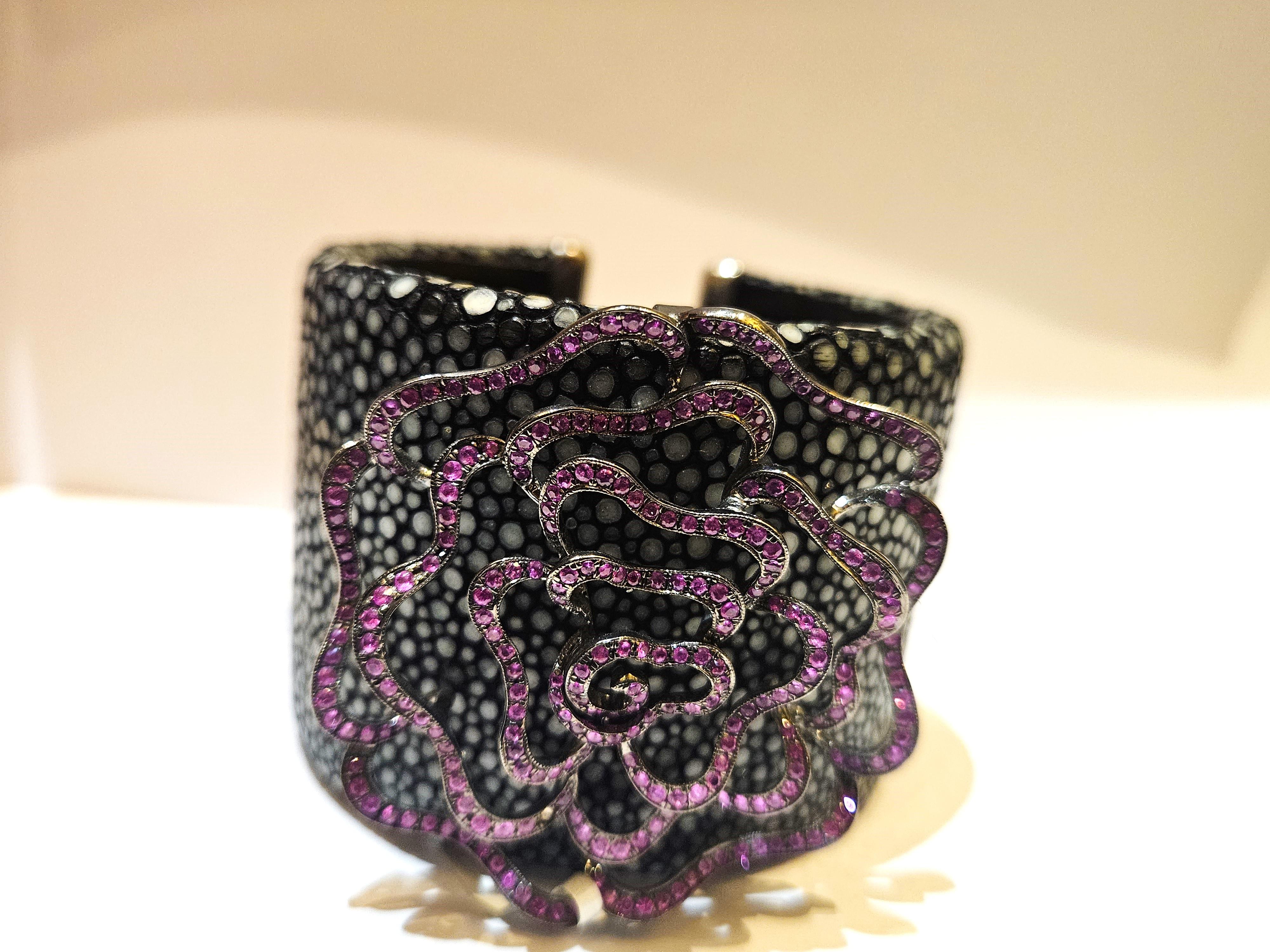 The Following Item we are offering is this Rare Magnificent FANCY PINK SAPPHIRE STINGRAY CUFF BANGLE BRACELET WITH APPROX 4CTS OF PINK SAPPHIRES!!! Taken out of a Private Collection. This Piece is a Rare Sample Piece that were sold in select Five