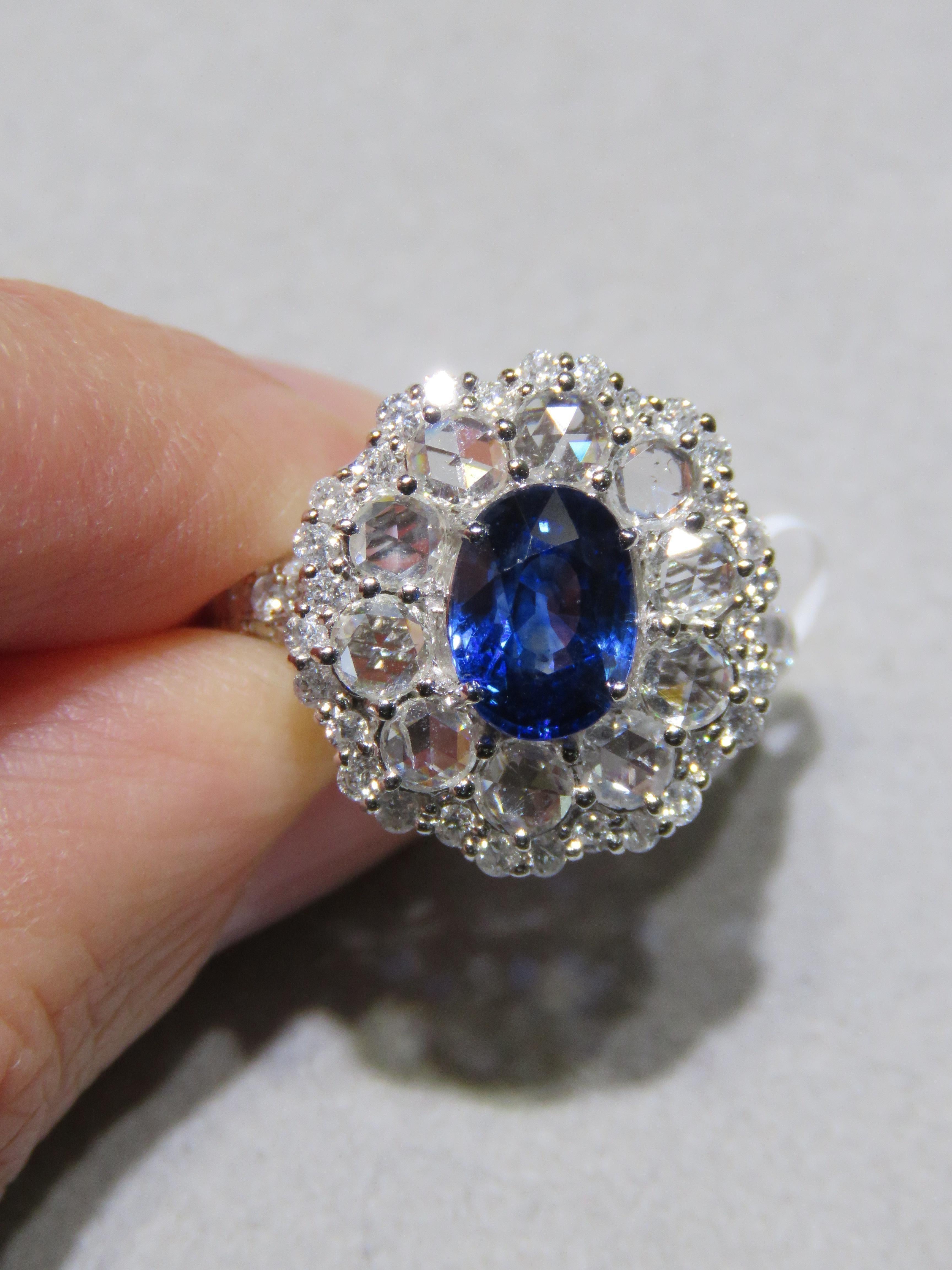 The Following Item we are offering is a Rare Important Spectacular and Brilliant 18KT Gold Large Gorgeous Sapphire Diamond Ring. Ring consists of a Rare Fine Magnificent Rare Blue Sapphire surrounded with Glittering Rose Cut Diamonds. T.C.W. Approx