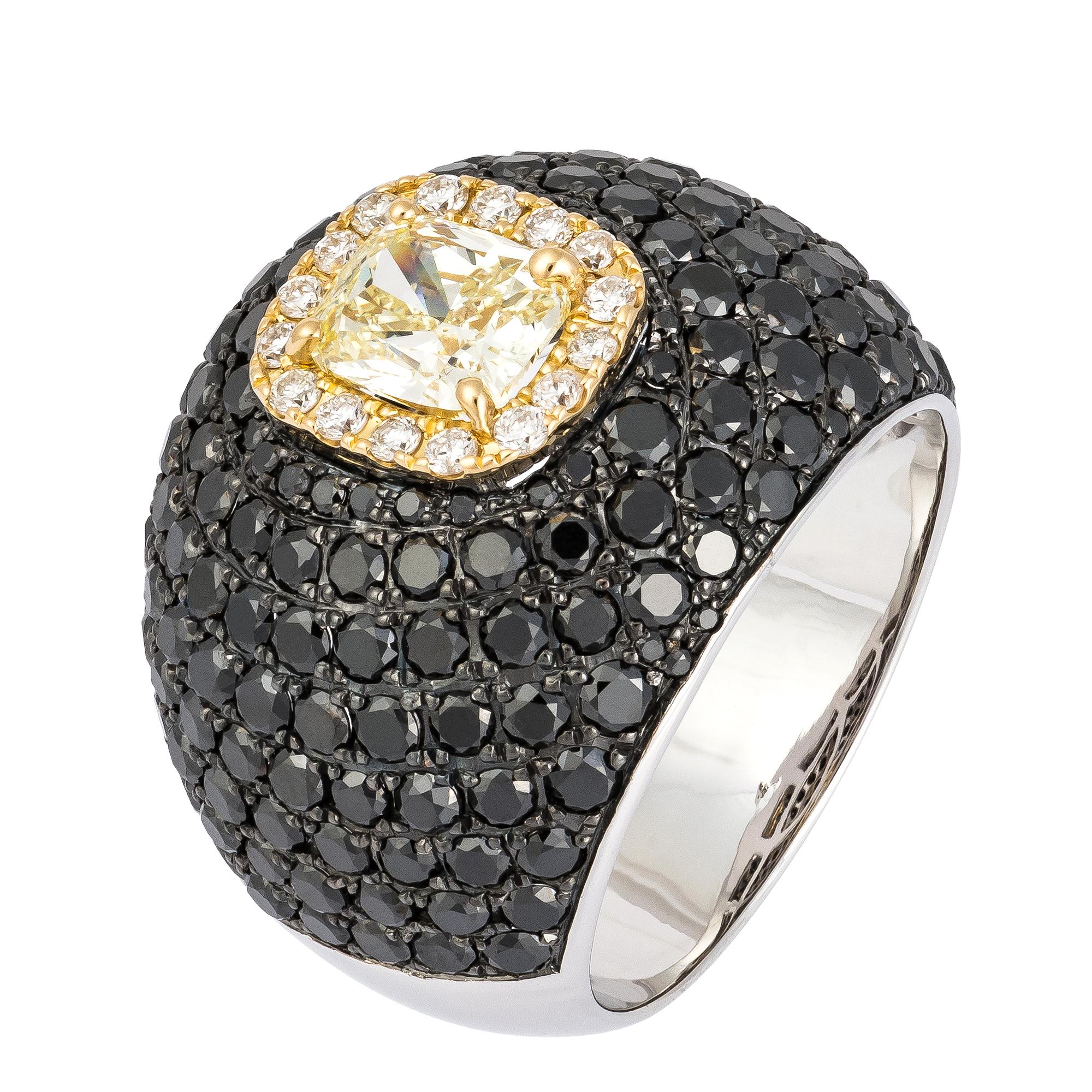 The Following Item we are offering is a Rare Important Radiant 18KT Gold Fancy Yellow and Black Diamond Ring! This Magnificent Fancy Yellow Diamond Ring Features over 5CTS of Pristine Round Cut Fancy Black Diamonds surrounded around a Yellow Diamond