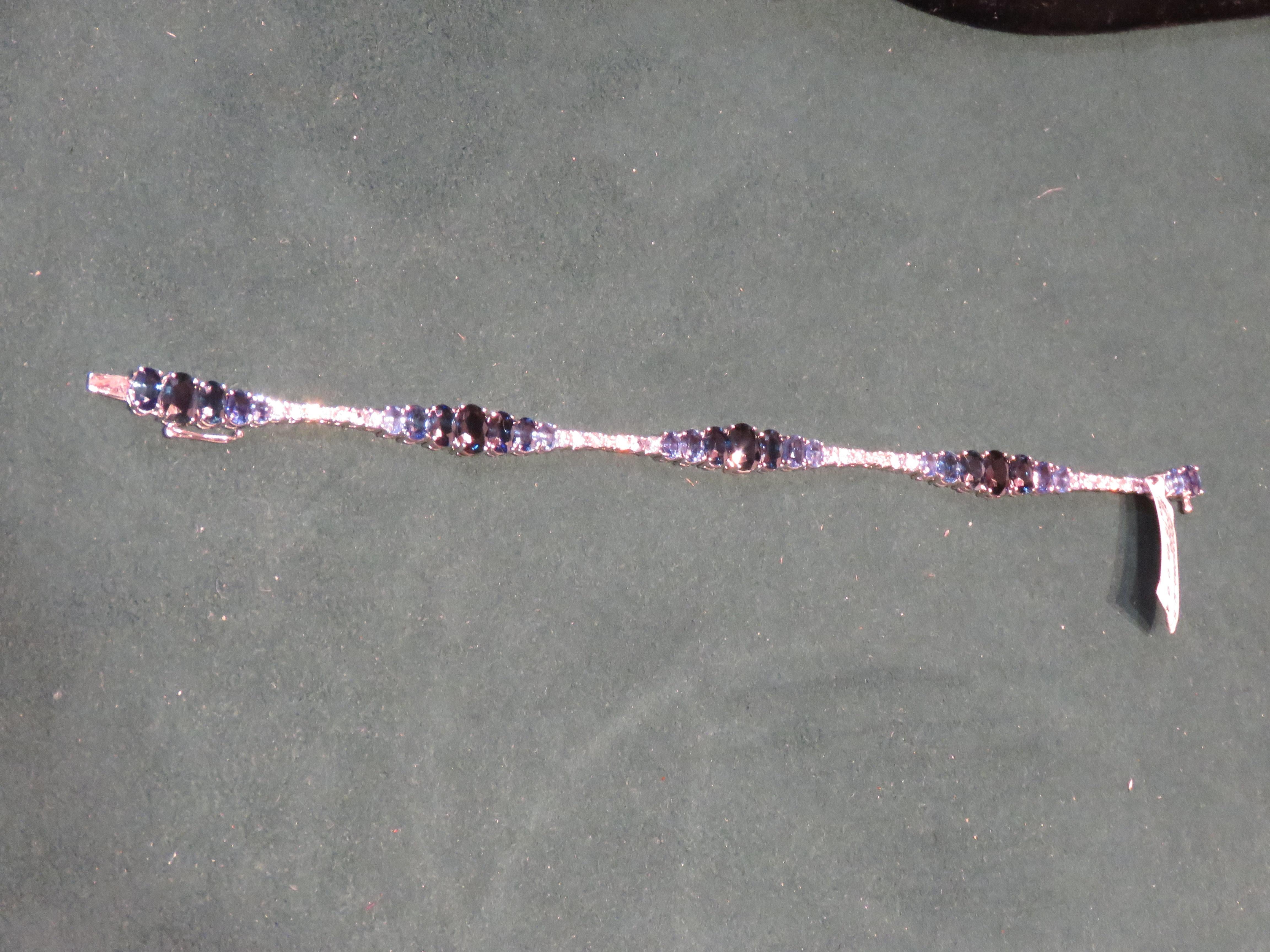 The Following Item we are offering is this Rare Important FANCY MULTI BLUE SAPPHIRE AND DIAMOND GOLD BRACELET!!! Bracelet consists of the Most Exquisite Shades of Blue Sapphires and Gorgeous Glittering Diamonds set in 18KT Gold!! Total Carat Weight