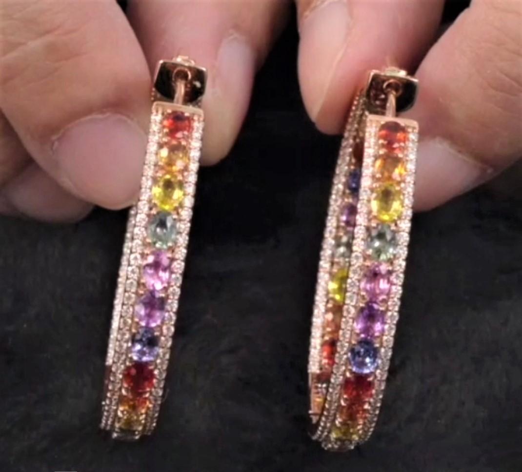 The Following Items we are offering is this Rare Important Radiant 18KT Gold Gorgeous Glittering and Sparkling Magnificent Fancy Rainbow Multi Color Sapphire Hoop Earrings. Earrings contain approx 11.50CTS of Beautiful Fancy Color Sapphires and