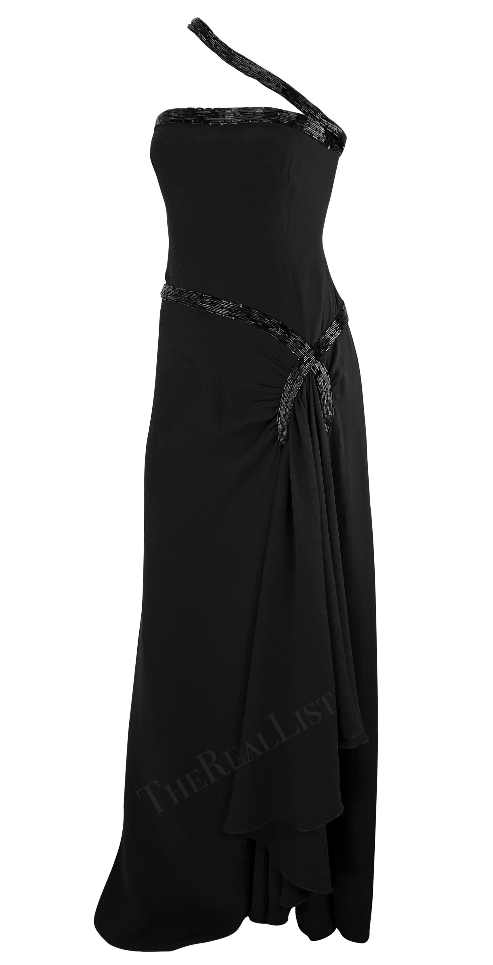 Introducing a fabulous floor-length black beaded gown designed by Valentino Garavani from the mid-2000s. This stunning gown is adorned with intricate black beadwork, adding to its allure. The beads elegantly embellish the shoulder strap, encircle