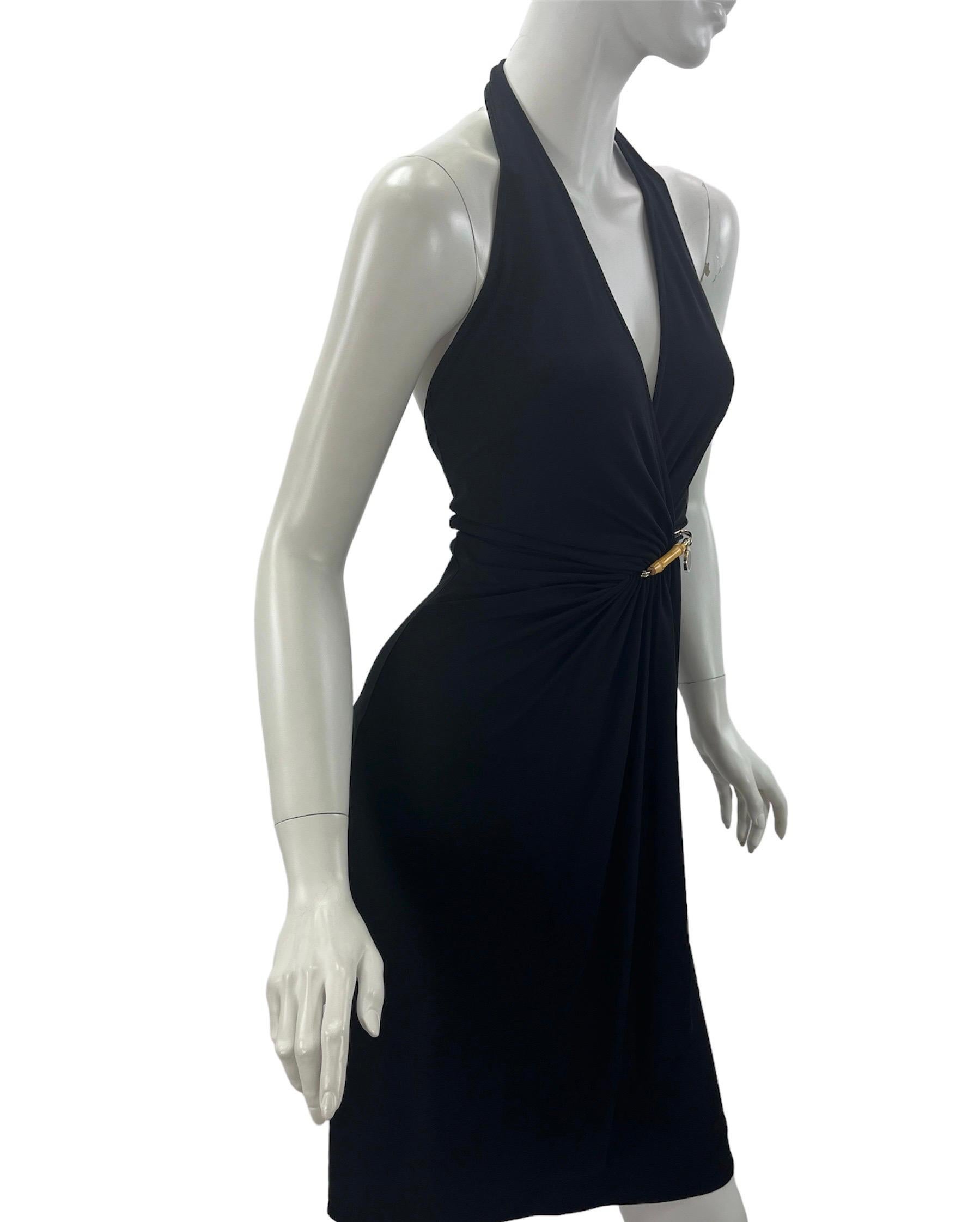 2006 Vintage Gucci Black Dress with Wrap Effect and Bamboo Pin
S/S 2006 Collection
Italian size 38 - US 2
Halter- Neck, Open Back, Fully Lined, Wrap Effect, Removable Bamboo Pin. 
92% Rayon, 8% Elastane. 
Measurements: Length - 39 inches, Waist -