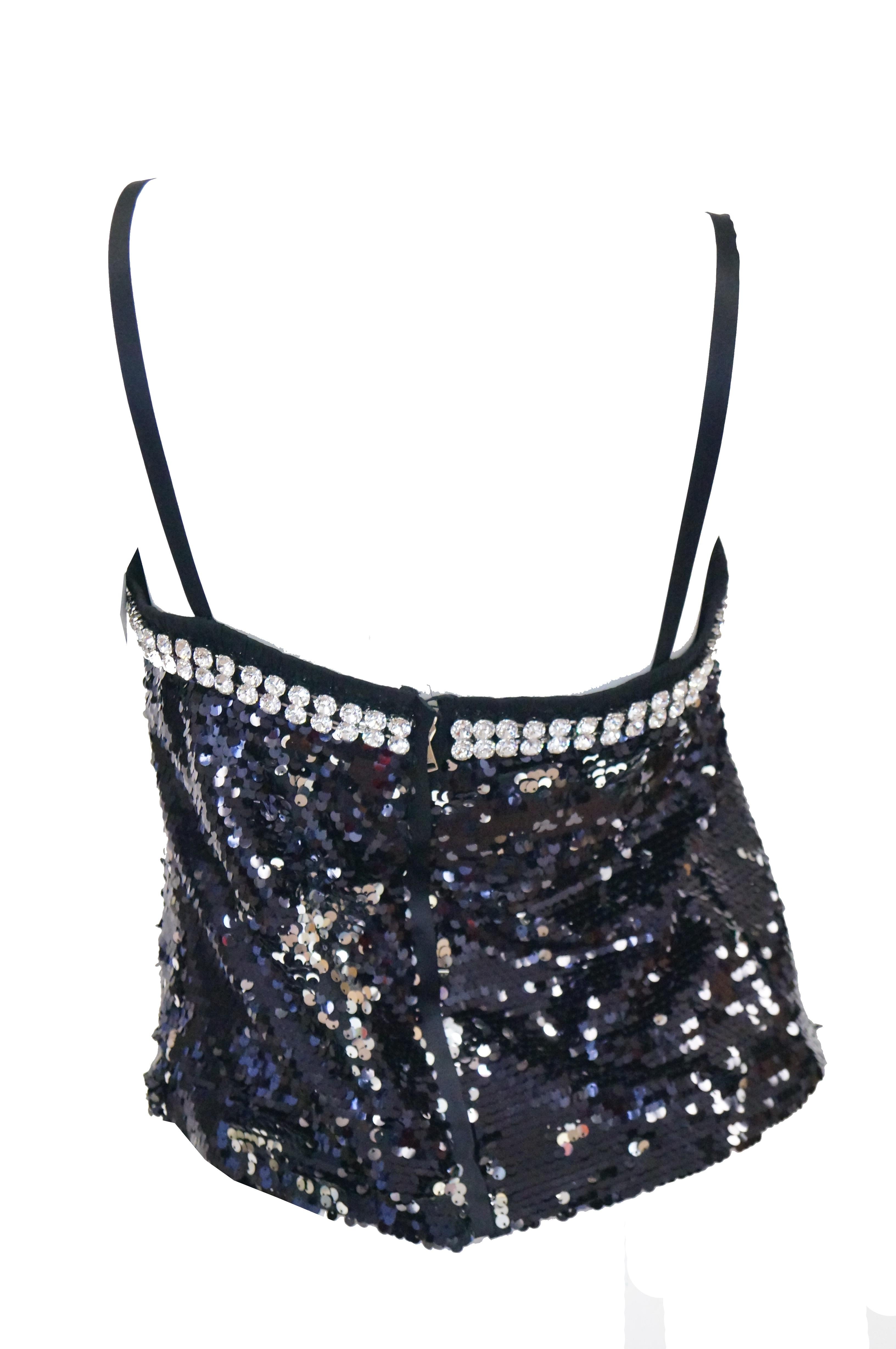 Brilliant loose shift tube - top - style camisole spaghetti strap top by Dolce & Gabbana! The body features two tone sequins in black and silver for added fun and versatility. The edge of the camisole features a double border of brilliant oversized