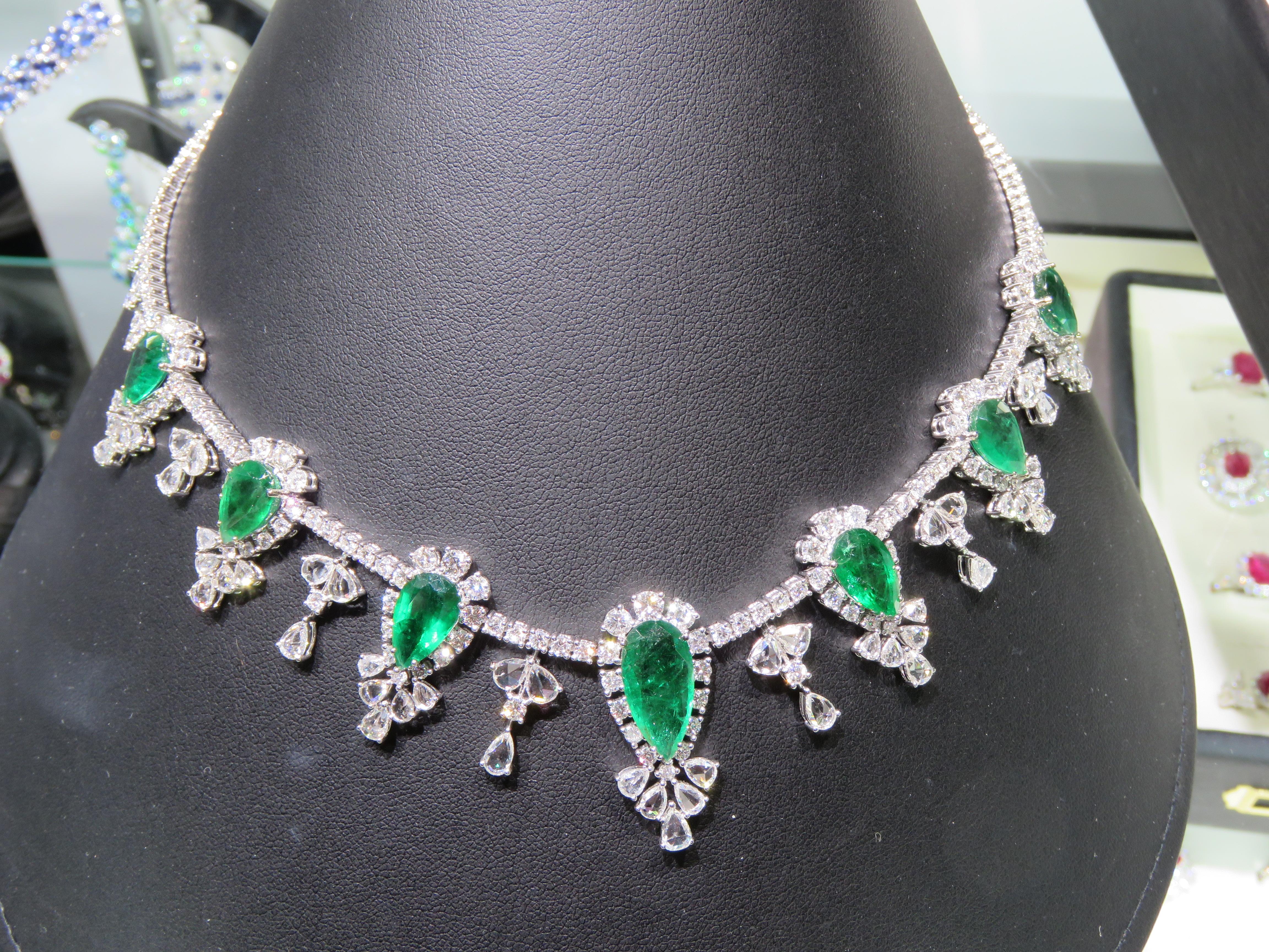 A Rare 18KT White Gold Emerald Diamond Necklace. Necklace is comprised of Finely Set Glittering Gorgeous Pear Shaped Emeralds and adorned with Sparkling Rose Cut and White Diamonds!! T.C.W. approx 43CTS!!! This Gorgeous Necklace is a Sample Piece