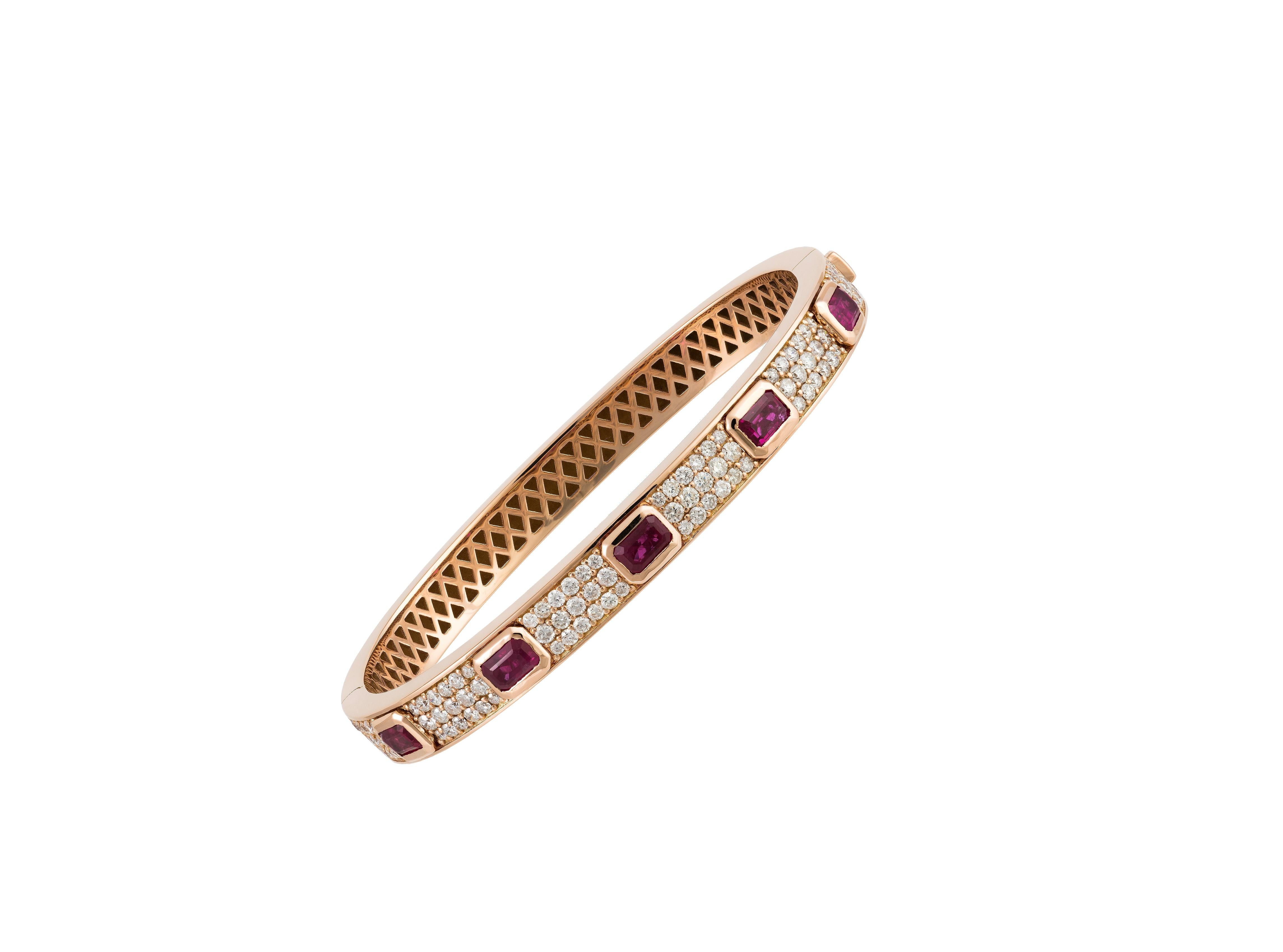 The Following Item we are offering is a Rare Magnificent Radiant 18KT Gold Large Rare Gorgeous Fancy Diamond Ruby Bangle Bracelet. Bracelet is comprised of Beautiful Glittering Rubies and Diamonds T.C.W. Approx 4CTS!!! This Gorgeous Bangle is a Rare
