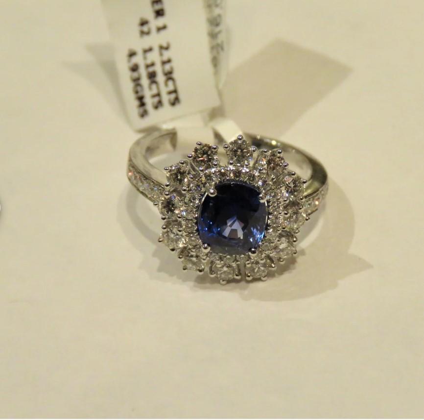 The Following Item we are offering is this Beautiful 18KT Rare Important Large Ceylon Blue Sapphire and Diamond Ring!!! Magnificent Large Sapphire Center Stone Approx surrounded by a Sunburst Crest and Halos of Round Glittering Diamonds and