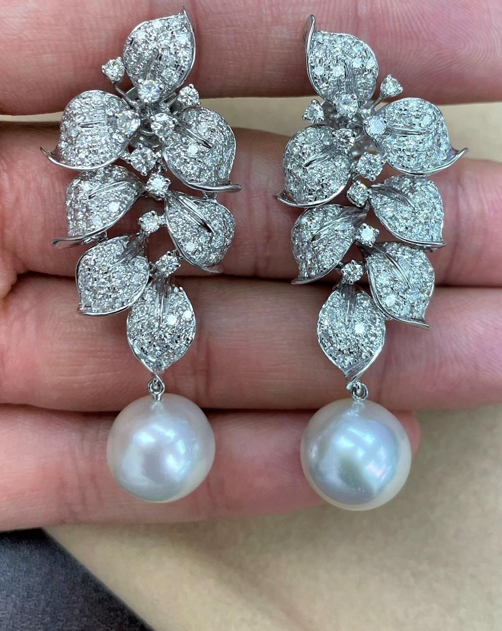 The Following Items we are offering are these Extremely Rare Beautiful 18KT White Gold Fine Large South Sea Pearl Earrings comprised of approx. 4 Carats of Fine Glittering Fancy White Diamonds!! These Extremely Rare Gorgeous White Pearls are Highly