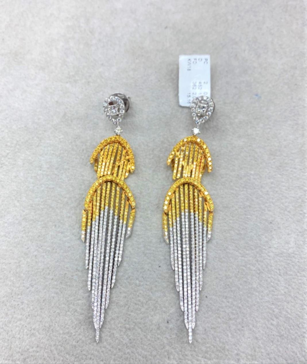 The Following Items we are offering is a Rare Important Radiant 18KT Gold Glamorous and Elaborate Rare Magnificent Glittering Diamond Fringe Design Earrings. Earrings feature Rare Sparkling Fine Glittering Fancy Yellow and White Diamonds set in 18KT