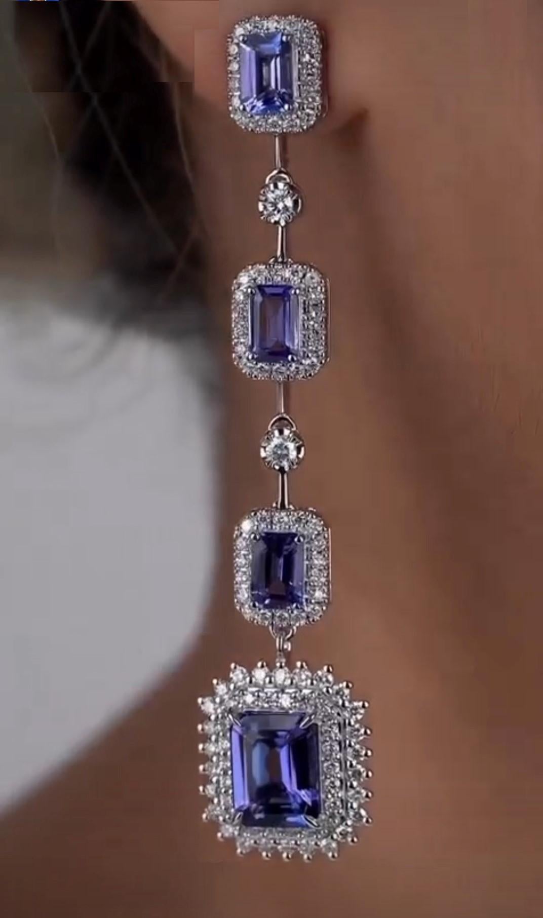 The Following Items we are offering is a Rare Important Radiant Pair of 18KT Gold Large Glistening Magnificent Large Fancy Gorgeous Tanzanite Diamond Dangle Earrings. Stones are Very Clean and Extremely Fine! Approx Over 10CTS!!! 
These Magnificent