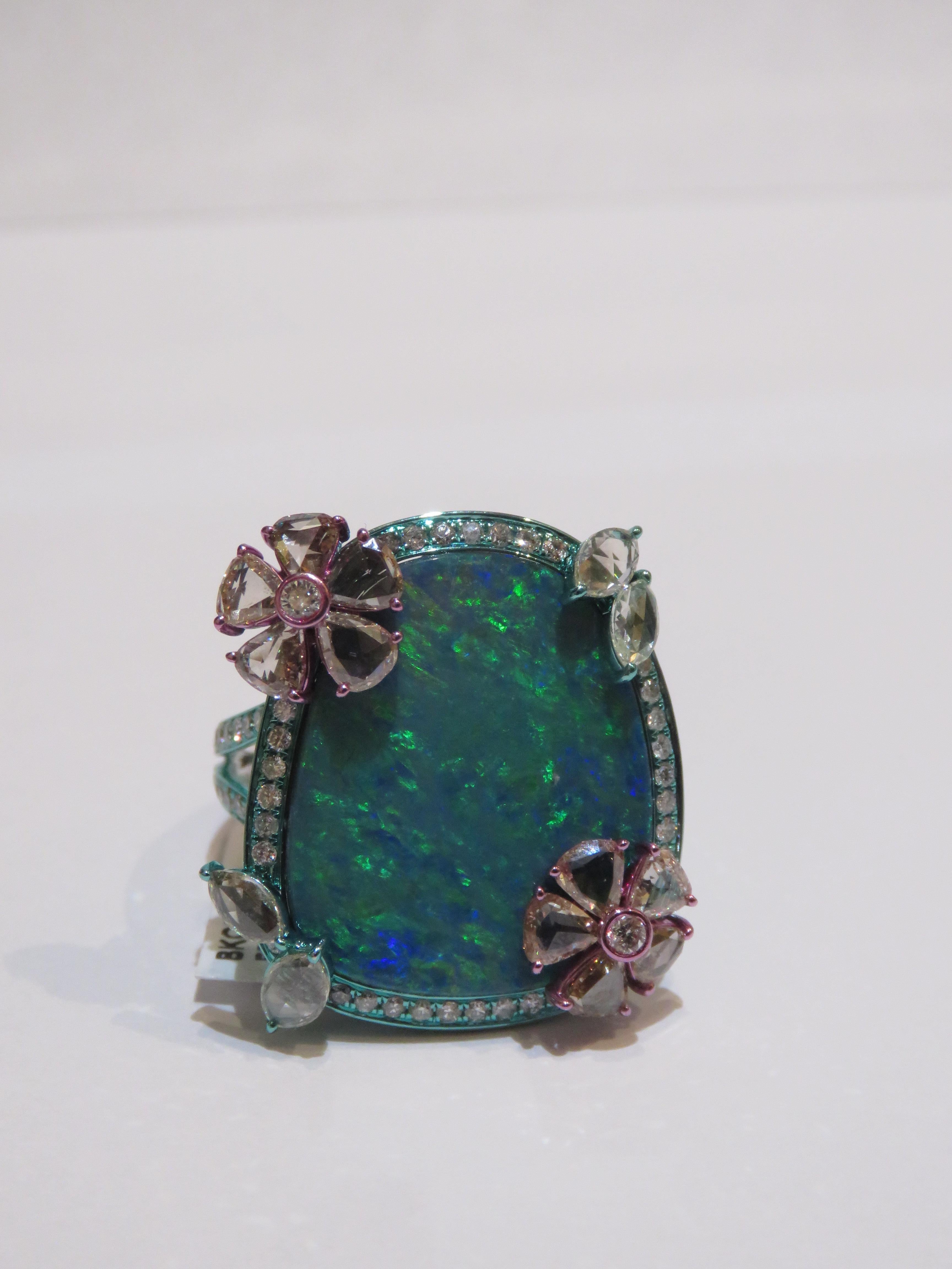 The Following Items we are offering is a Rare Important Radiant 18KT Gold Glistening Australian Black Opal and Diamond Gorgeous Ring. Ring features a Magnificent Rare Color Changing Black Opal from Australia adorned with Outstanding Brilliant Rose