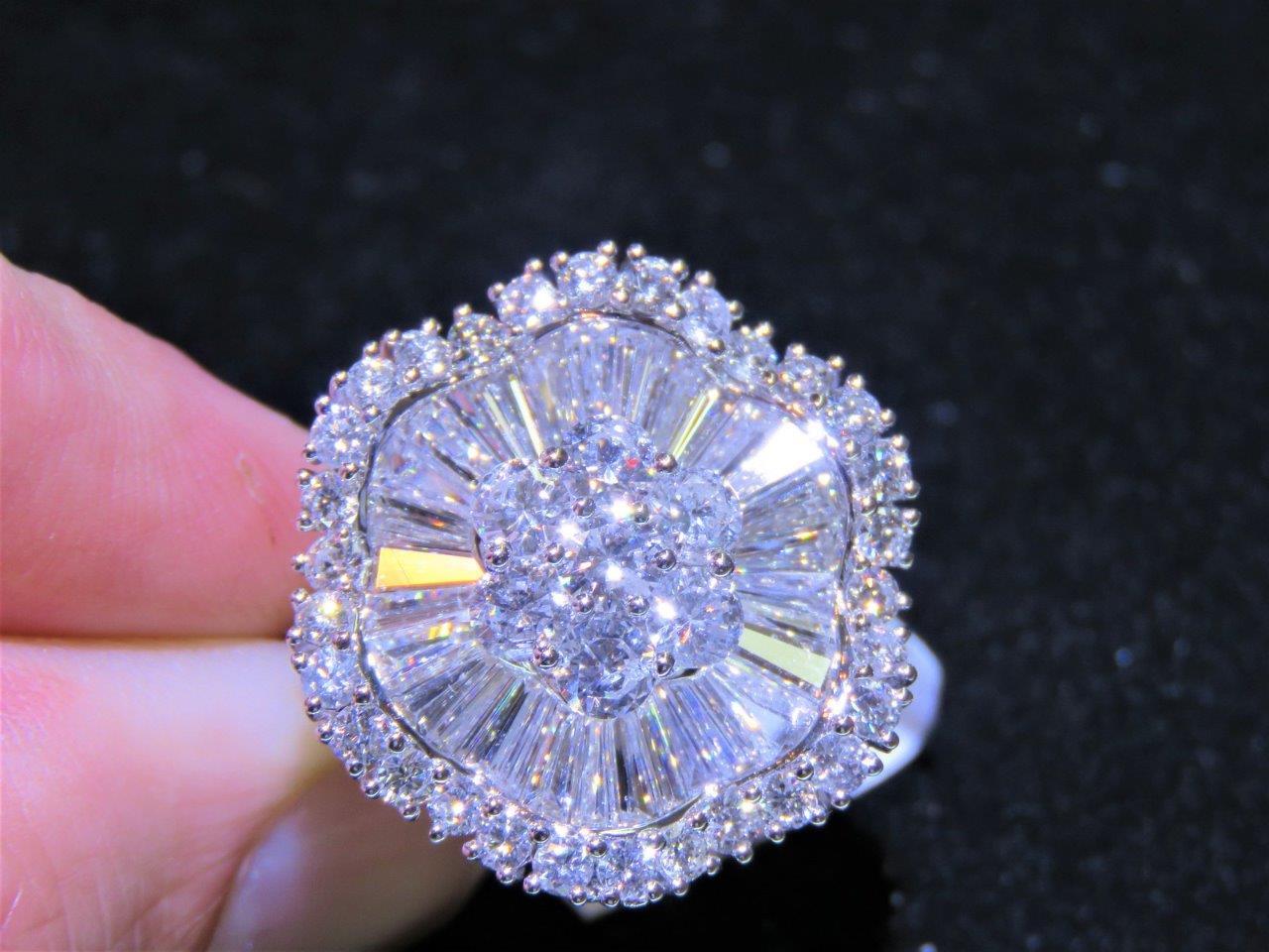 The Following Items we are offering is a Rare Important 18KT White Gold Large Diamond Floral Shaped Ring. Ring is comprised of Finely Set Glittering Diamonds forming a Flower. T.C.W. Approx 4CTS!! The Diamonds are of Exquisite and Fine Quality. This