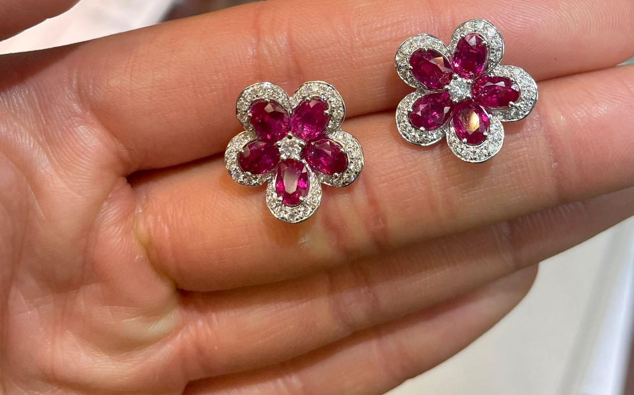 The Following Items we are offering are these Rare Important Radiant Pair of 18KT Gold Large Glistening Magnificent Fancy Ruby and Diamond Floral Flower Earrings. Earrings feature a Gorgeous Array of Magnificent Draping Glittering Diamonds and Rare