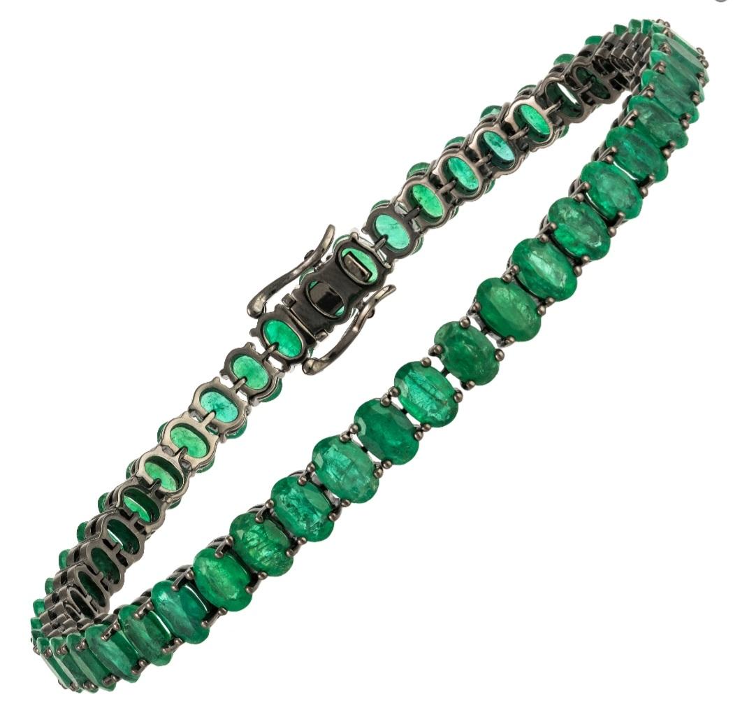 The Following Item we are offering is this Rare Important Radiant 18KT Gold Gorgeous Glittering and Sparkling Magnificent Fancy Oval Cut Emerald Tennis Bracelet. Bracelet Contains approx 21CTS of Beautiful Fancy Green Oval Cut Emeralds set in 18KT