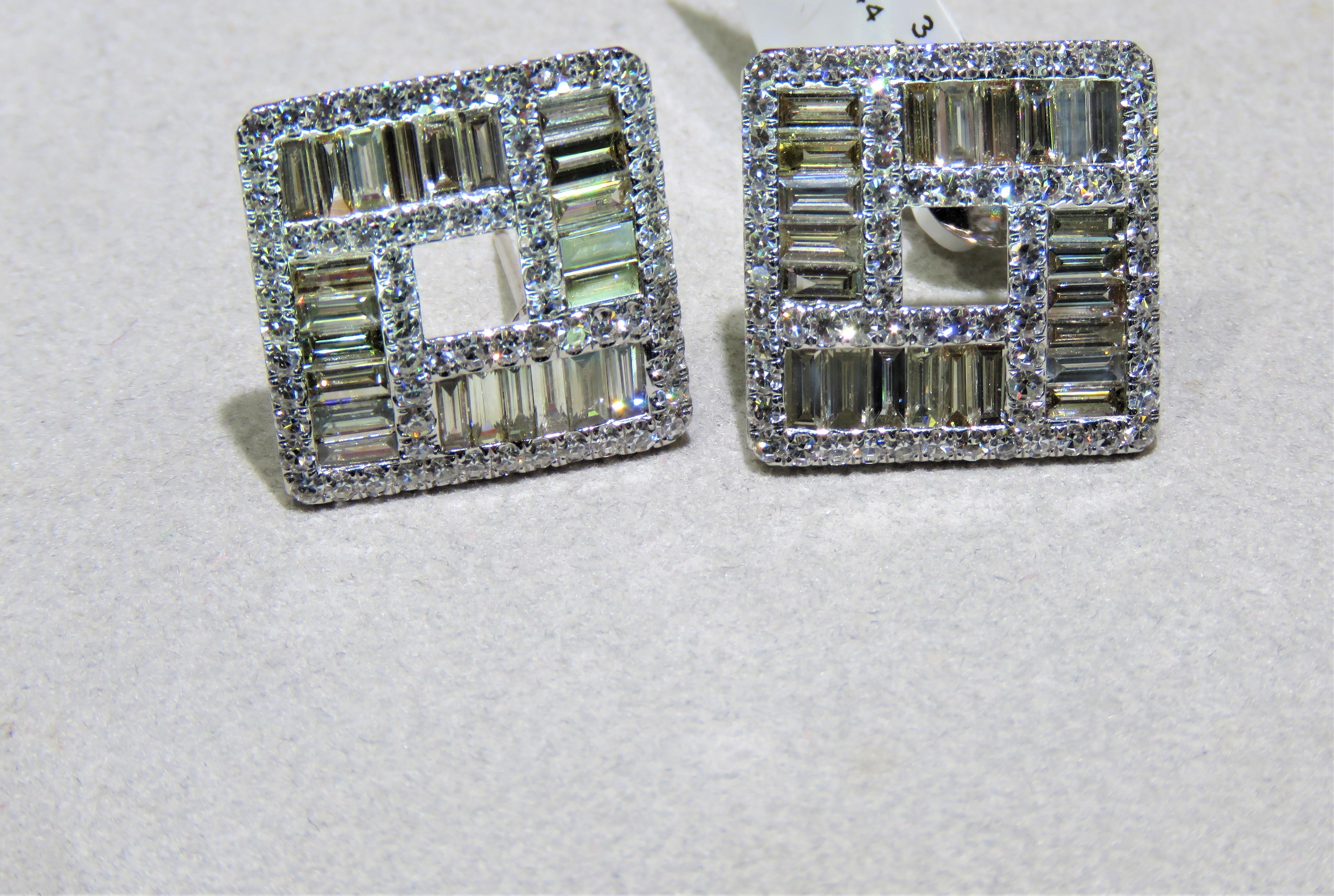 The Following Item we are offering are these Extremely Rare Beautiful 18KT Gold Fine Large Fancy Baguette Cut Trillion White Diamond Earrings. Each Earring features Rare Gorgeous Glittering Fancy Large Baguette Diamonds adorned with Sparkling White