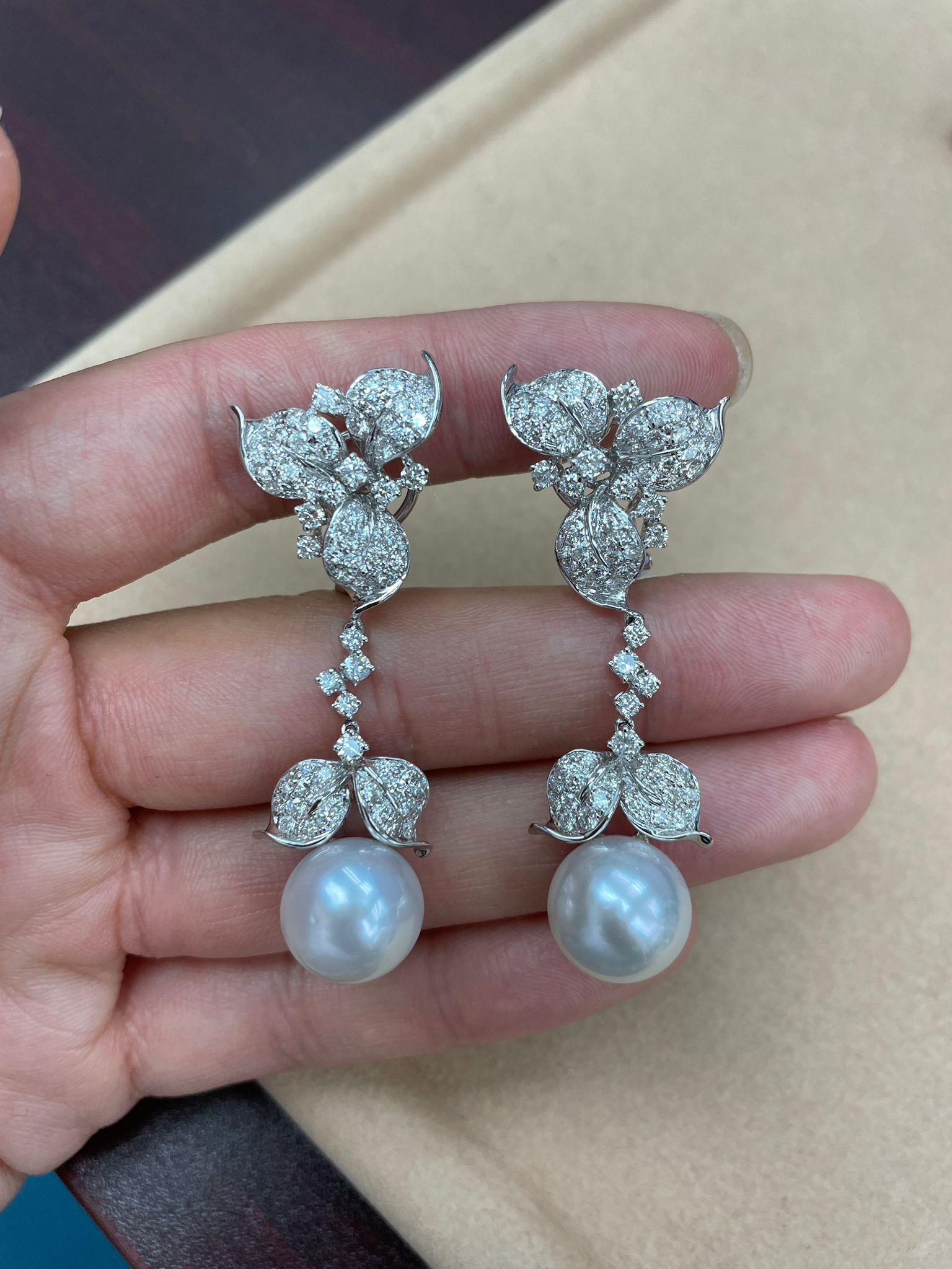 The Following Item we are offering are these Extremely Rare Beautiful 18KT Gold Fine Large Fancy South Sea White Pearl and Diamond Earrings. Each Earring features Gorgeous Glittering Diamonds in the forma of Flowers adorned by a Magnificent Fine