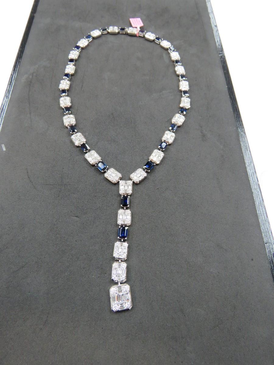 The Following Item we are offering is a Rare 18KT White Gold Large Baguette Diamond Blue Sapphire Necklace. Necklace is comprised of Finely Set Gorgeous Glittering Sapphires and Diamonds!! T.C.W. Approx 45CTS!! This Gorgeous Necklace is a Rare