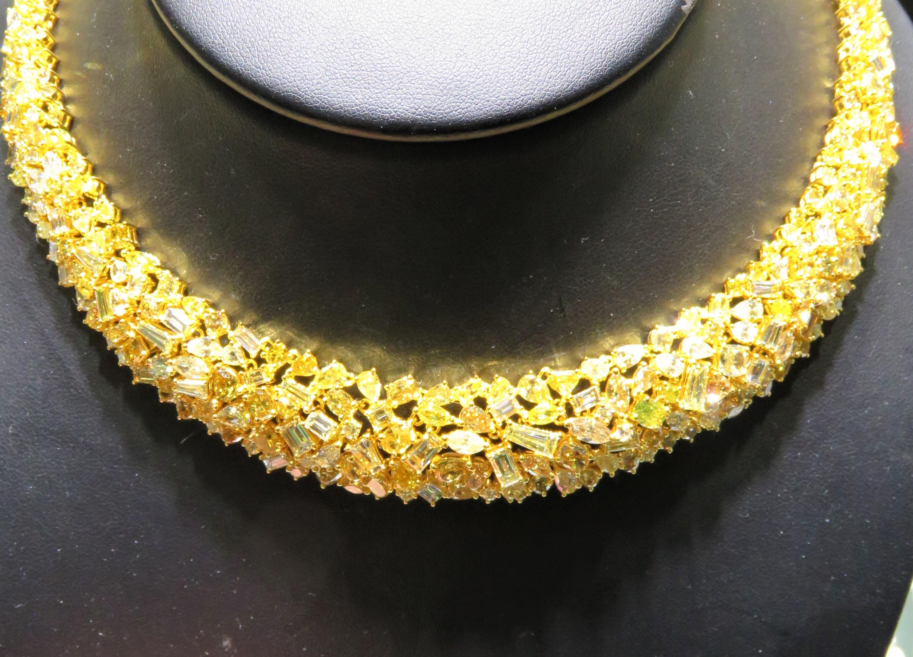 The Following Item we are offering is a Rare Important Radiant 18KT Gold Fancy Yellow Diamond Necklace! This Magnificent Fancy Yellow Diamond Necklace Features Pristine Cut Fancy assorted shades of Fancy Yellow Diamonds!! This Gorgeous Necklace from