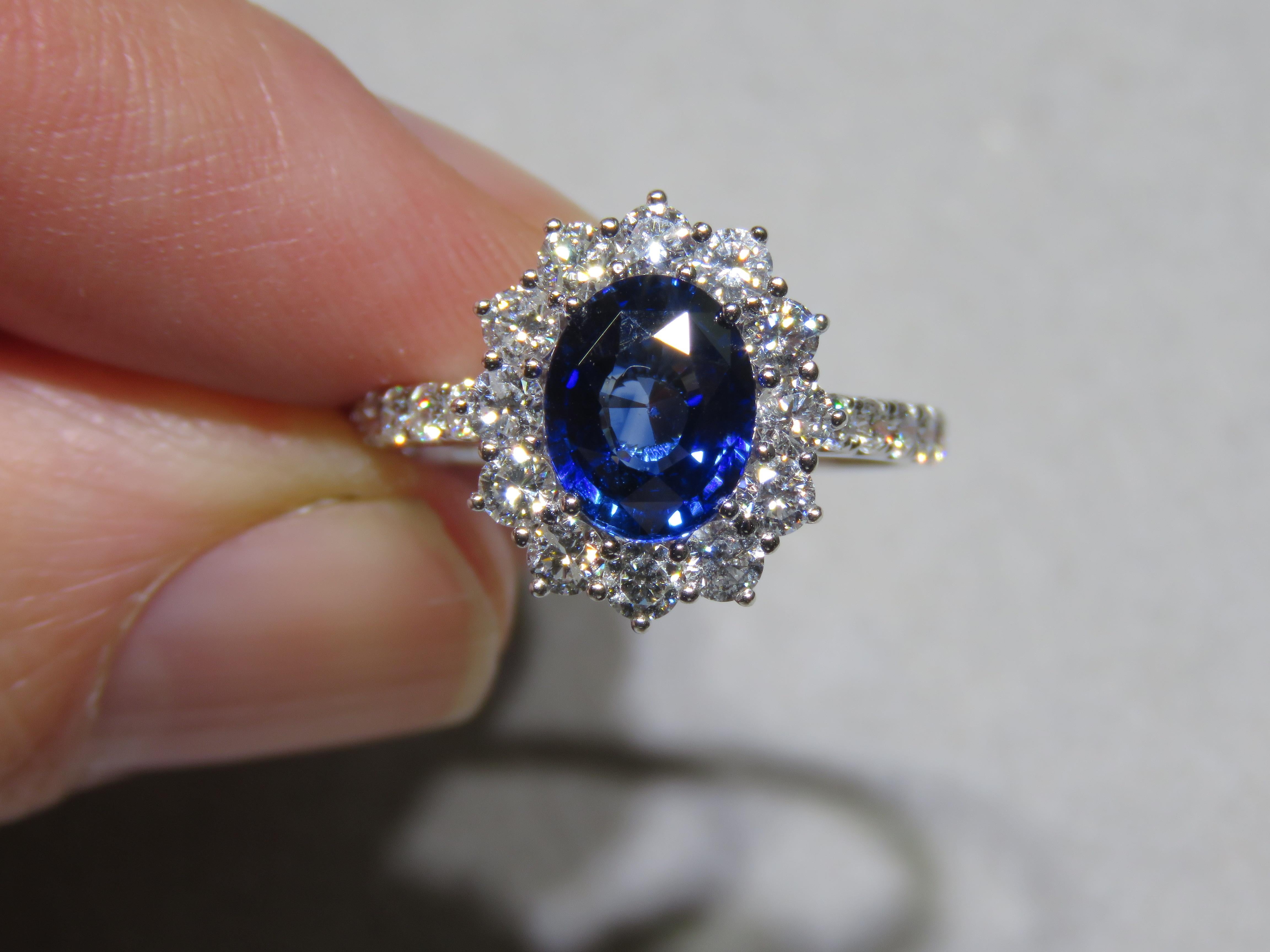 The Following Item we are offering is a Rare Important Spectacular and Brilliant 18KT Gold Large Gorgeous Sapphire Diamond Ring. Ring consists of a Rare Fine Magnificent Rare Blue Sapphire surrounded with Glittering Diamonds. T.C.W. Approx