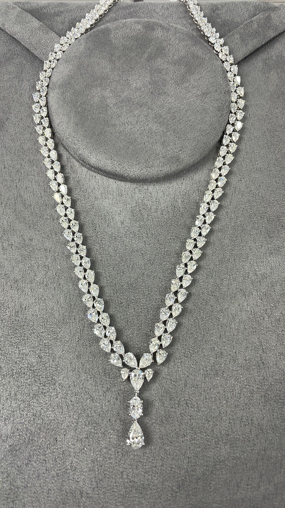 The Following Item we are offering is a Rare Important Gorgeous 18KT White Gold Winston Style Glistening GIA CERTIFIED Fancy Diamond Drop Necklace!!!! This Necklace is Outstanding Multi Pear Shaped Glittering Diamond Necklace with 2 Large GIA