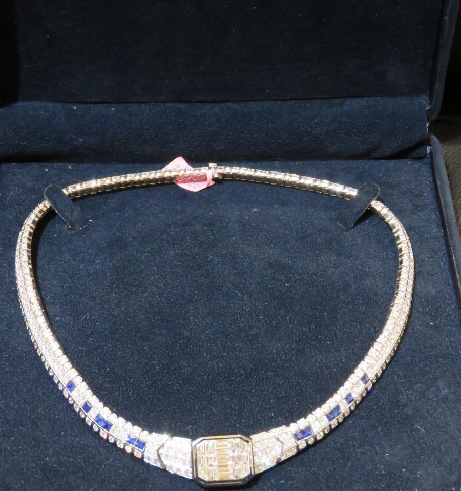 The Following Item we are offering is a Rare 18KT White Gold 28CT Large Baguette Diamond Blue Sapphire Necklace. Necklace is comprised of Finely Set Gorgeous Glittering Diamond and Diamonds!! T.C.W. Approx 28CTS!! This Gorgeous Necklace is a Rare