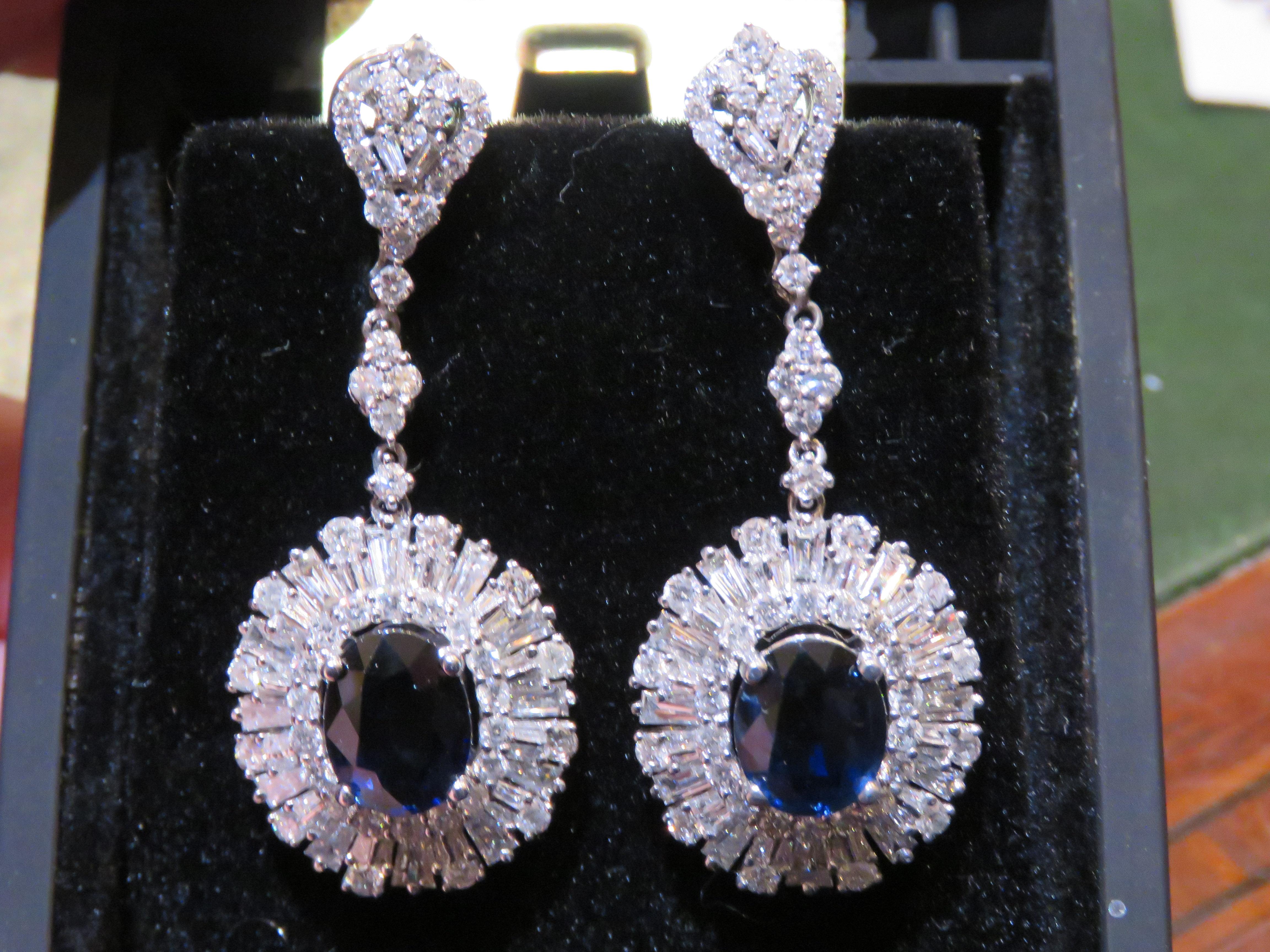 The Following Items we are offering is a Rare Important Radiant and Elaborate 18KT White Gold Large Ceylon Sapphire and Diamond Earrings. Earrings are comprised of Approx 10 Carats of Finely Set Glittering Ceylon Sapphire Stones and Diamonds. The