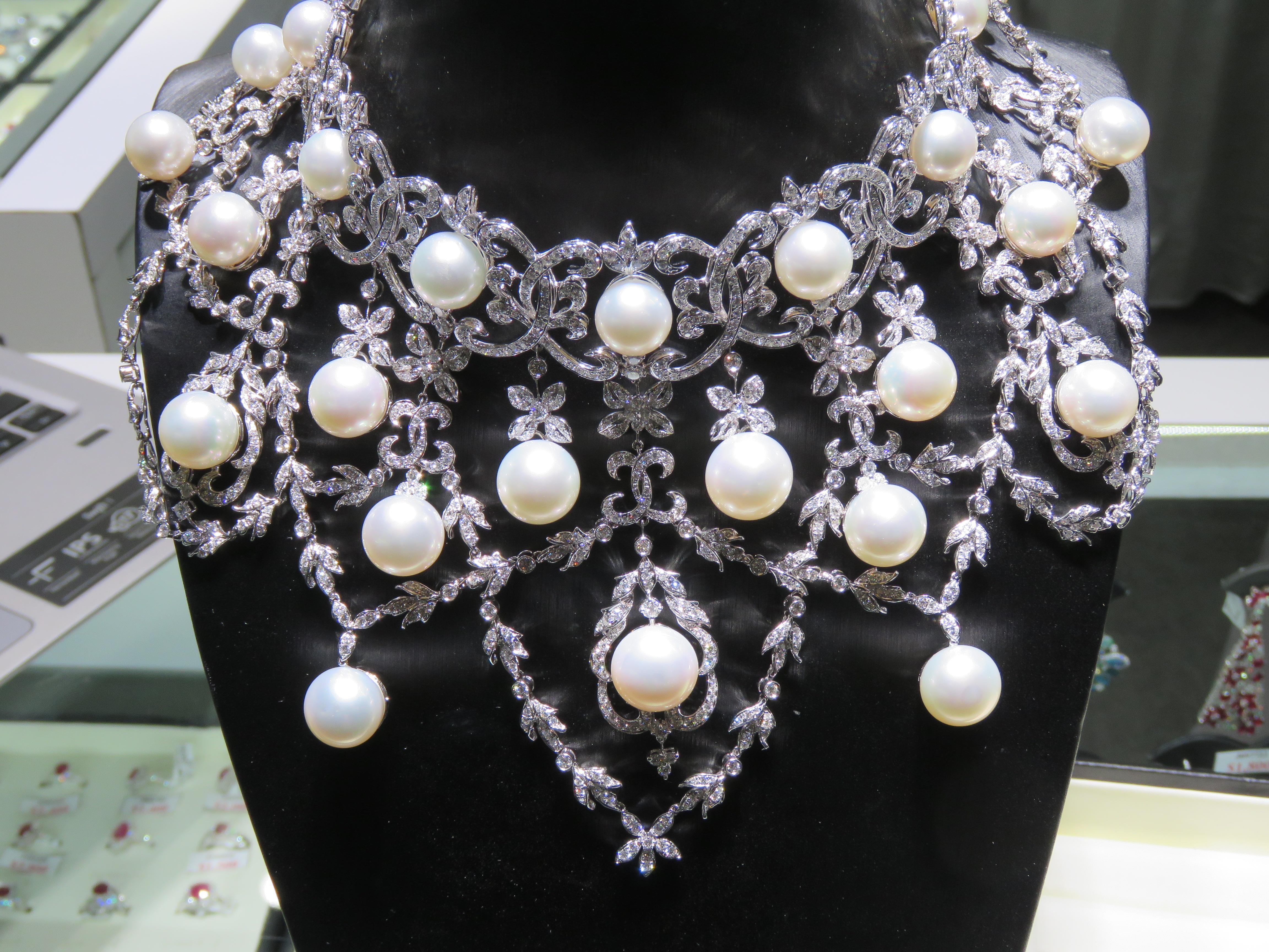 The Following Item we are offering is this Beautiful Rare Important 18KT Gold Fancy South Sea Pearl Extraordinary Draping Diamond Flower Necklace. Necklace is comprised of 24 Magnificent High Luster Large AA-AAA SOUTH SEA PEARLS that give off a