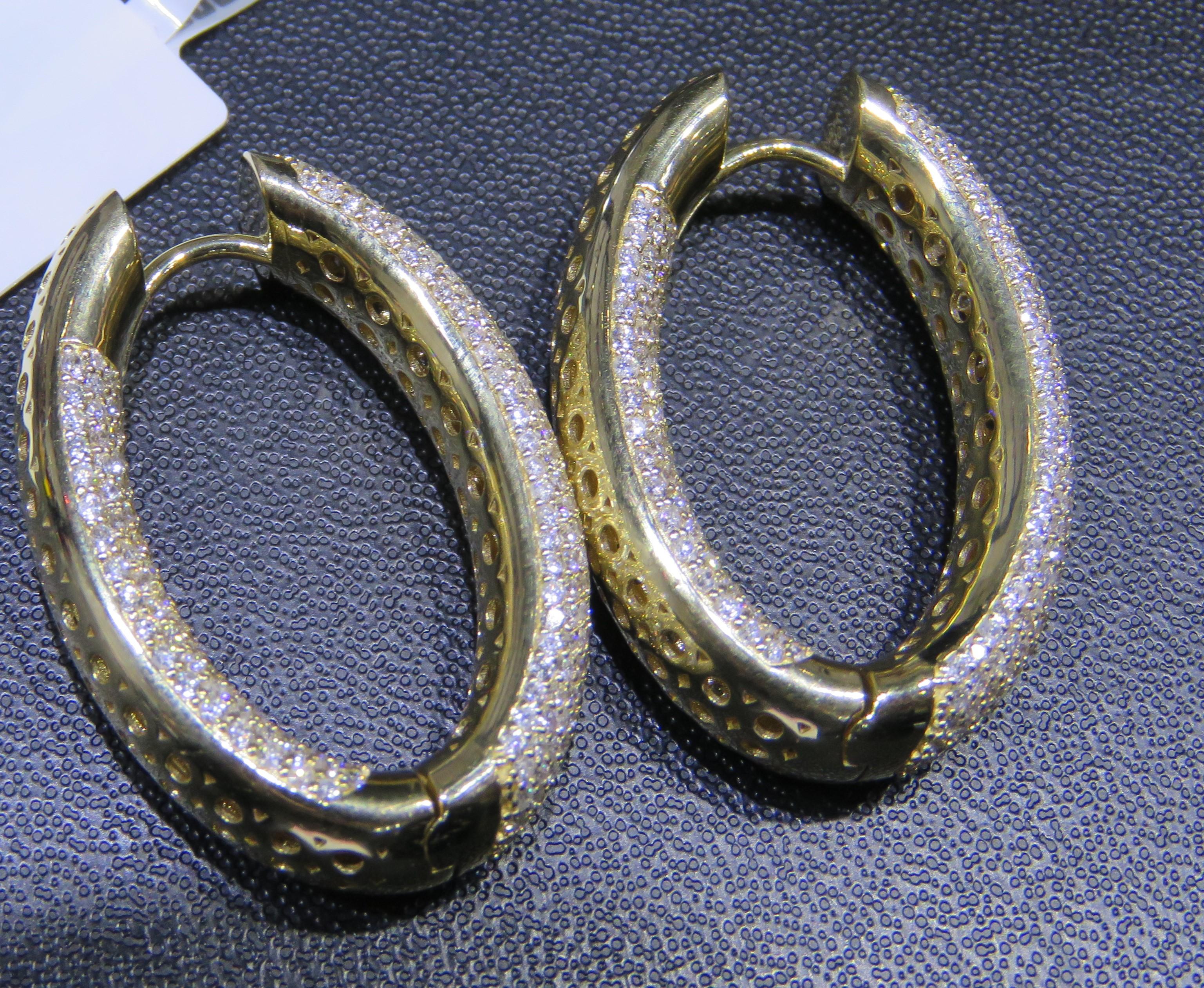 The Following Items we are offering is this Rare Important Radiant 18KT Yellow Gold Gorgeous Glittering and Sparkling Magnificent Fancy Diamond Hoop Earrings. Earrings contain approx 5.50CTS of Beautiful Fancy Diamonds!!! Stones are Very Clean and