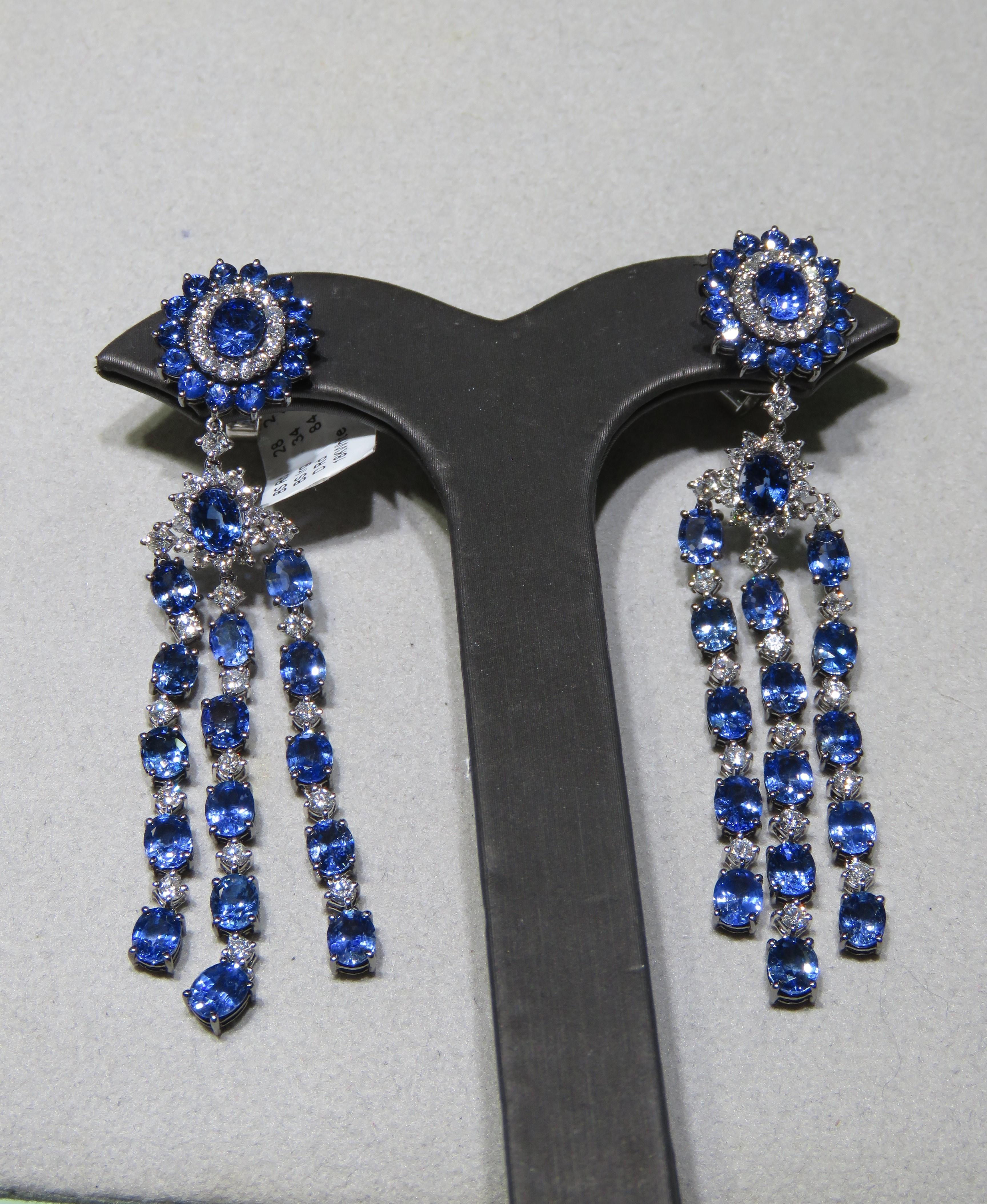 The Following Item we are offering are these Extremely Rare Beautiful 18KT Gold Fine Large Fancy Blue Sapphire Dangle Earrings. Each Earring features Rare Gorgeous Glittering Fancy Blue Sapphires Draped with Sparkling White Diamonds in 18KT Gold.